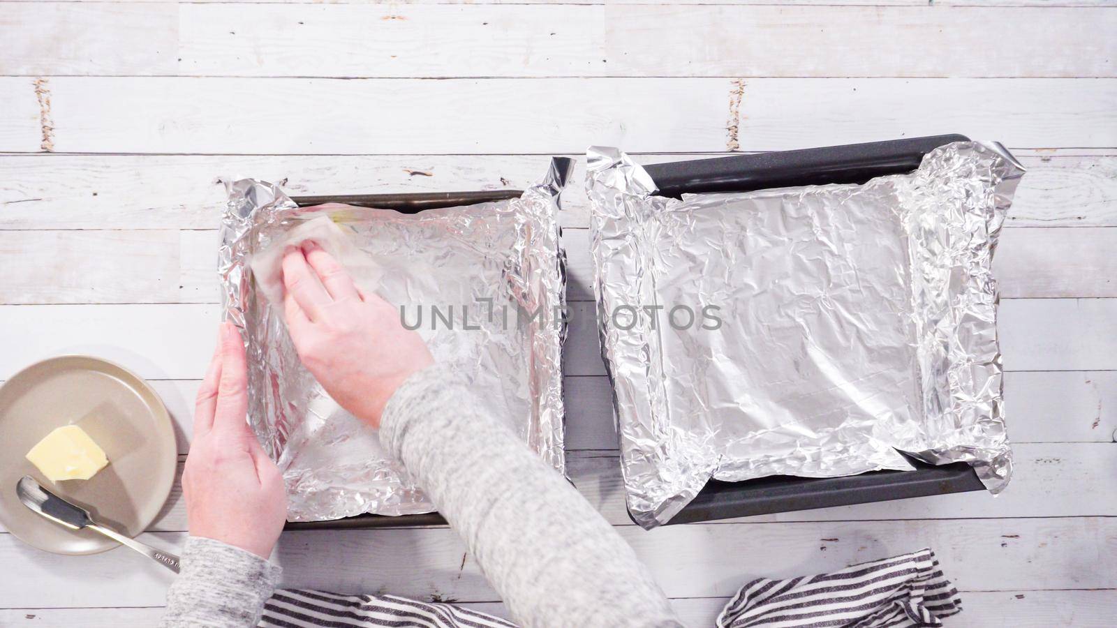 Flat lay. Step by step. Greasing baking pan to make homemade fudge.