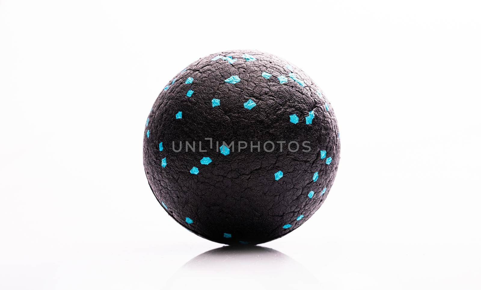 Massage therapy ball for muscle relaxation. Medical equipment for body recovery and stress relief
