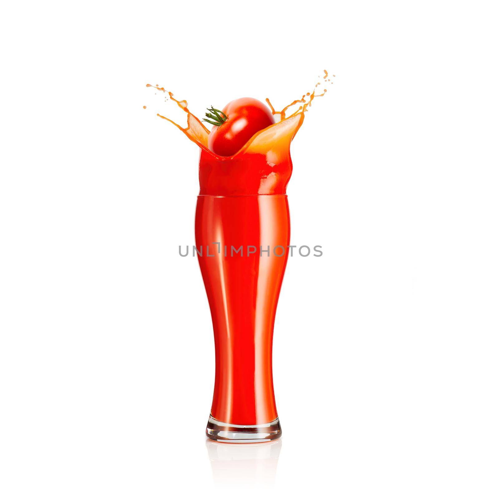 splash of tomato juice isolated on white background. juice in glass splashing by PhotoTime