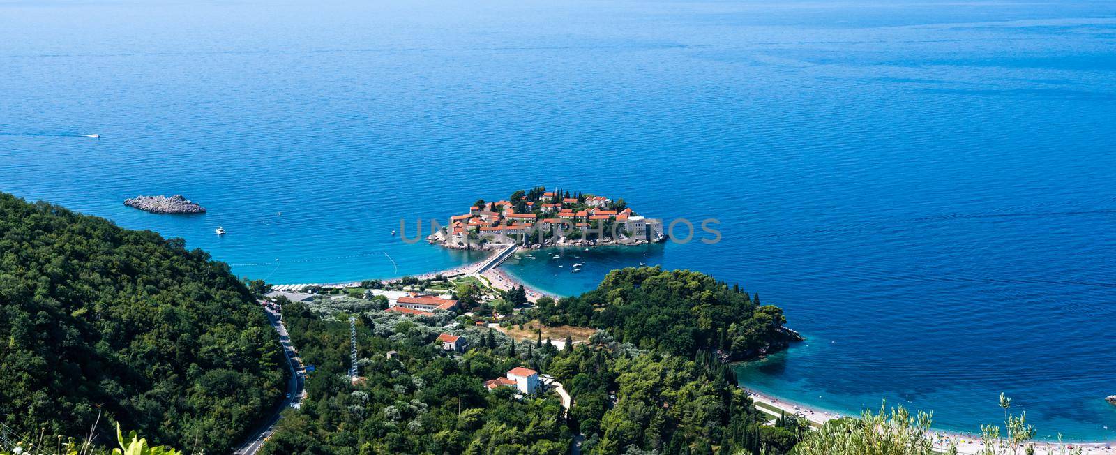 Sveti Stefan island in Montenegro from above. Scenic view on adriatic sea from mountains close to Budva