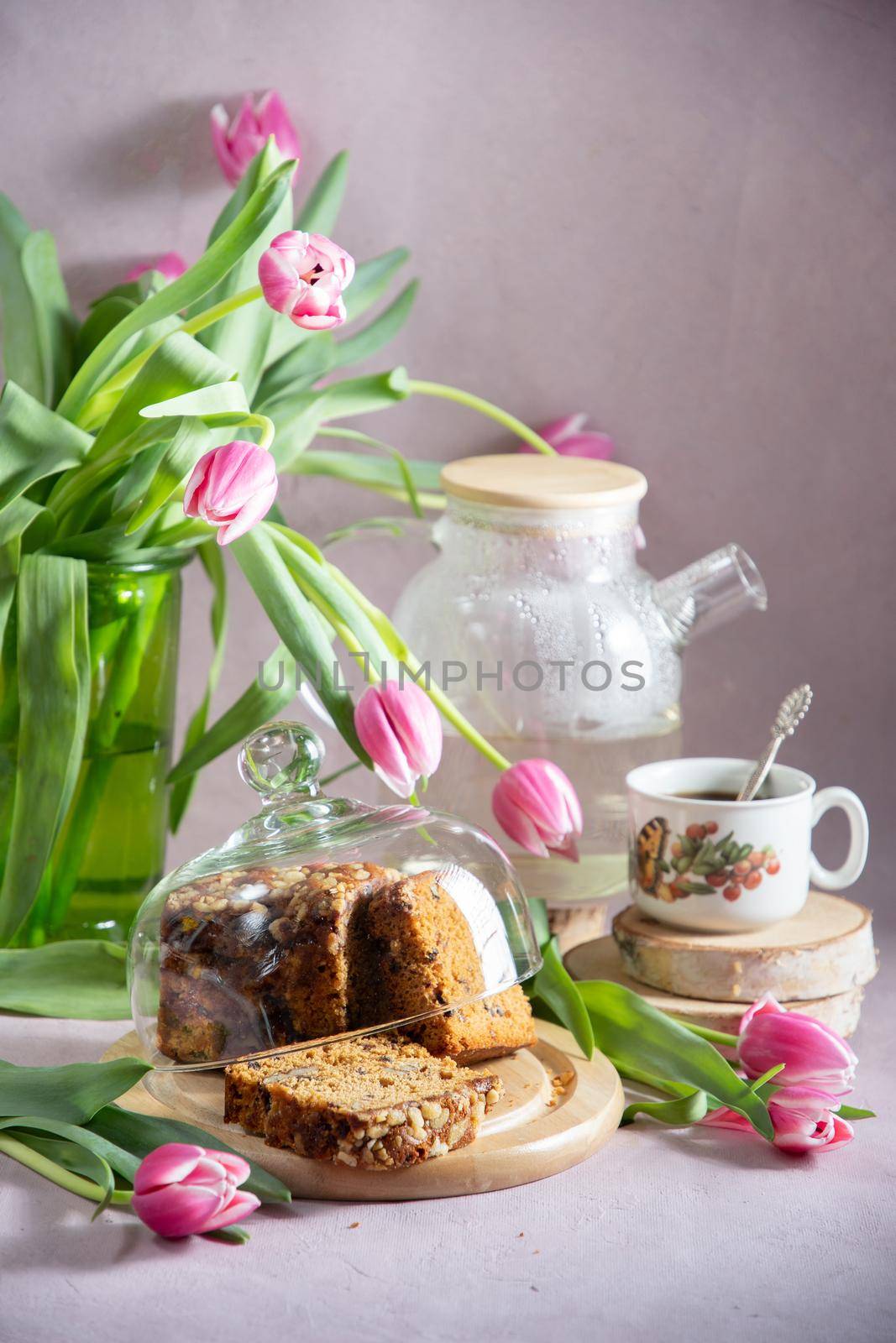 Still life, concept of early spring breakfast with coffee or tea and cupcake by KaterinaDalemans