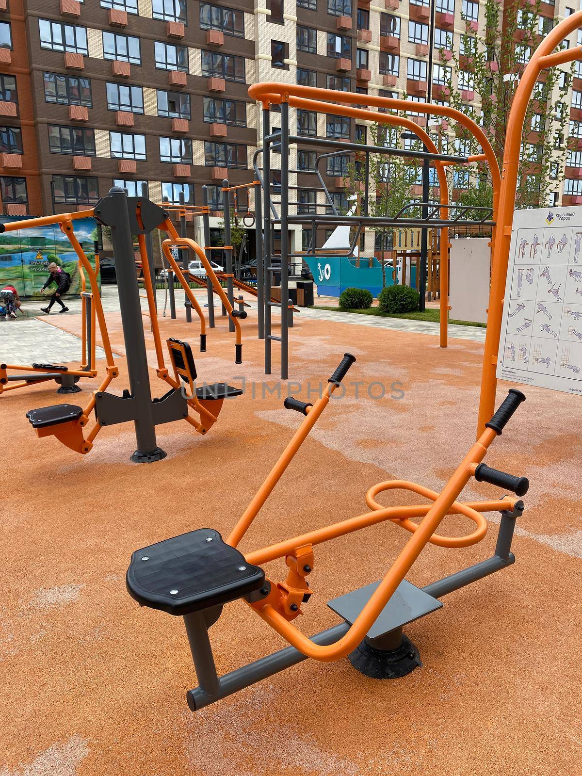 Colorful children's playgrounds in the courtyard of a residential building. Safe modern playground. Arrangement of the courtyard of a new building.