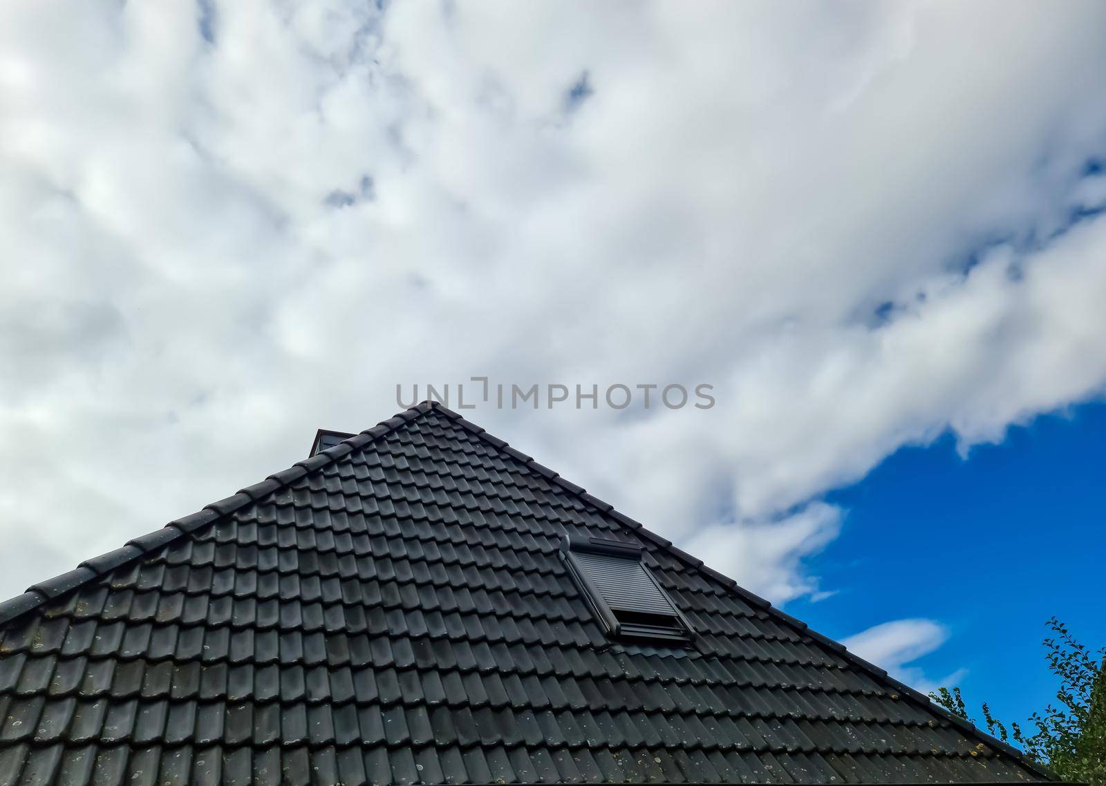 Open roof window in velux style with black roof tiles. by MP_foto71