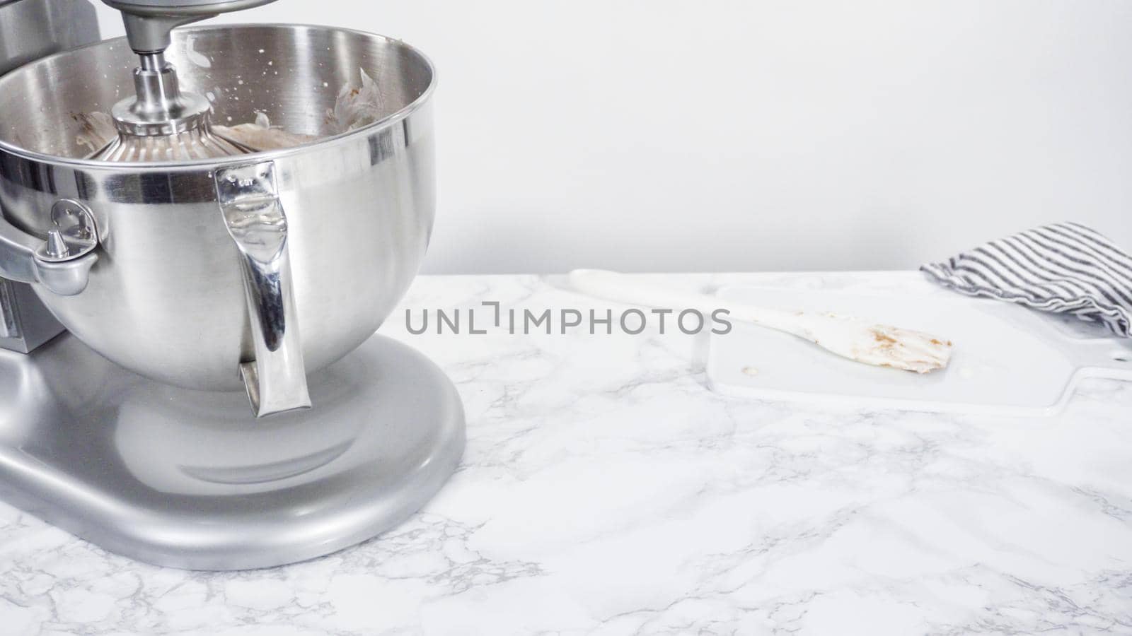 Step by step. Preparing homemade chocolate ice cream in a standing kitchen mixer.