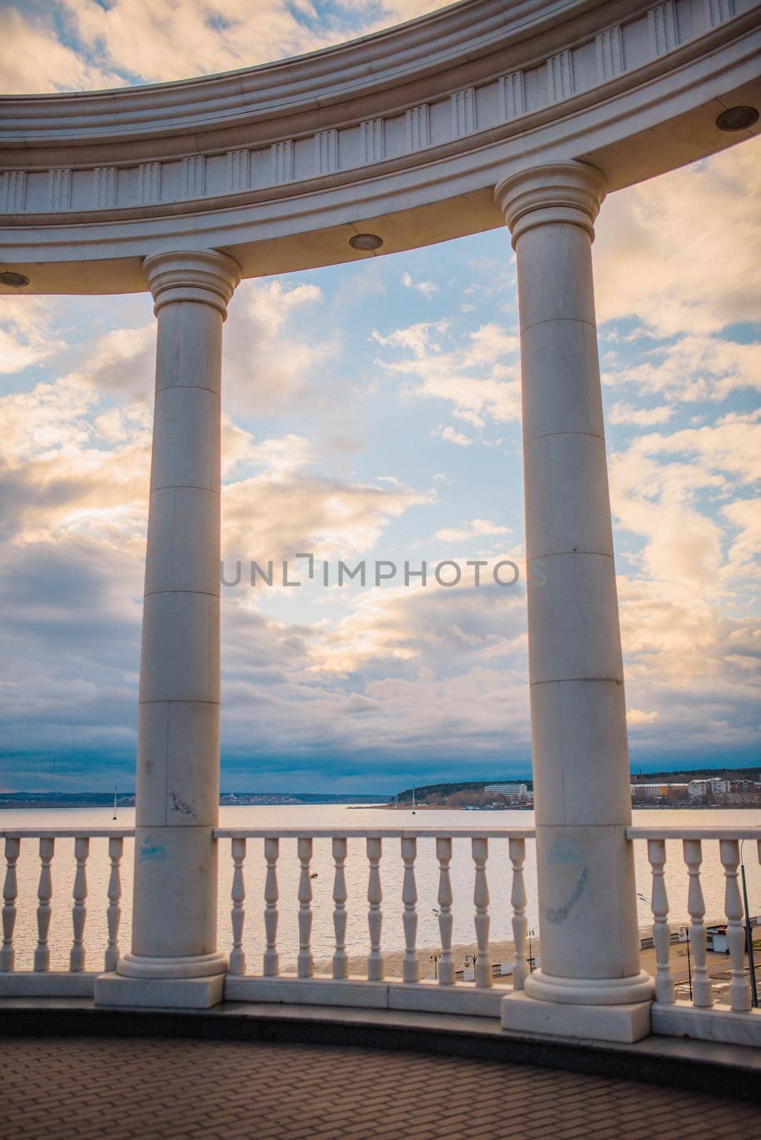 beautiful white columns overlooking the lake. Architecture of the city in Russia.