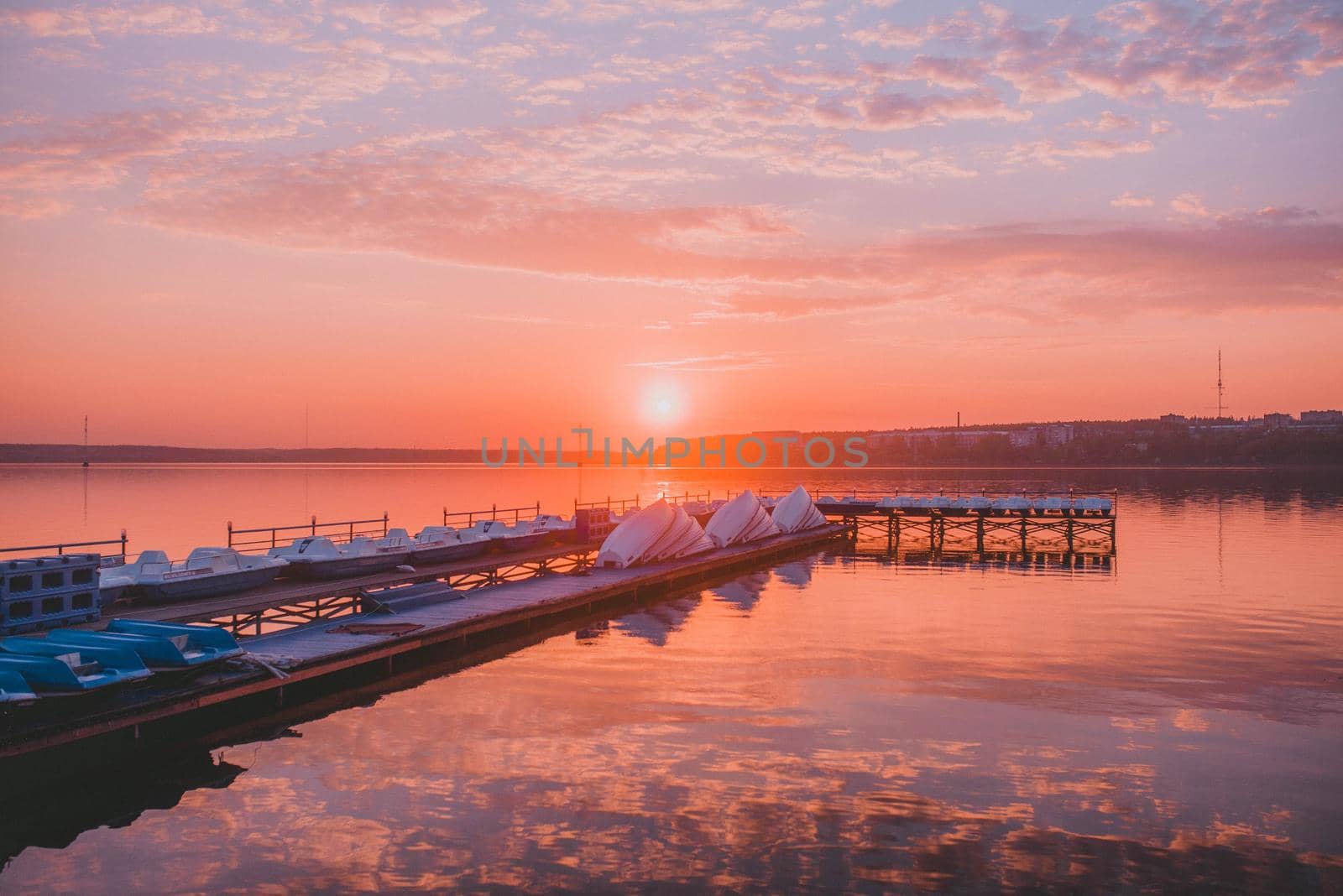 wooden pier with boats at sunset by Hitachin