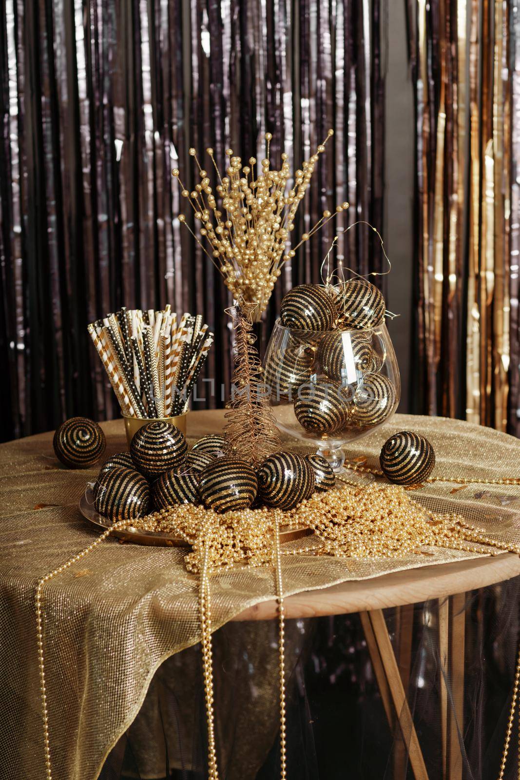 Bright Christmas decor. Christmas and New Year interior in black and gold colors. Winter holiday background by Matiunina