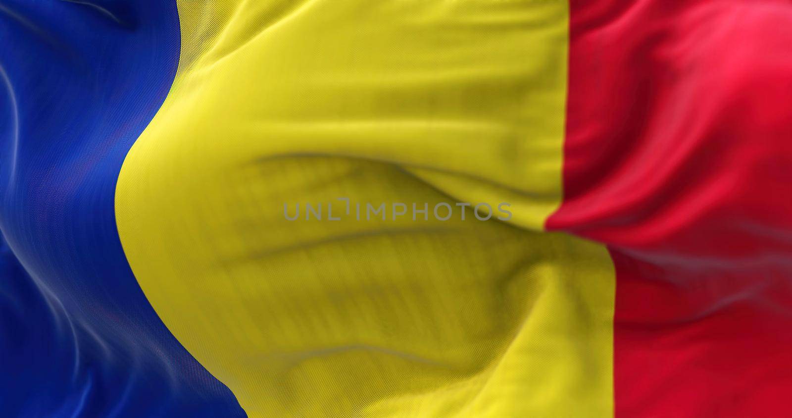 Close-up view of the Romania national flag waving in the wind by rarrarorro