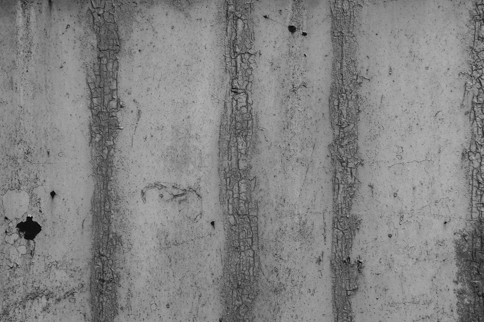 Old rough cement wall without plaster, damaged due to moisture and microorganisms. Grunge wall, concrete wall background.