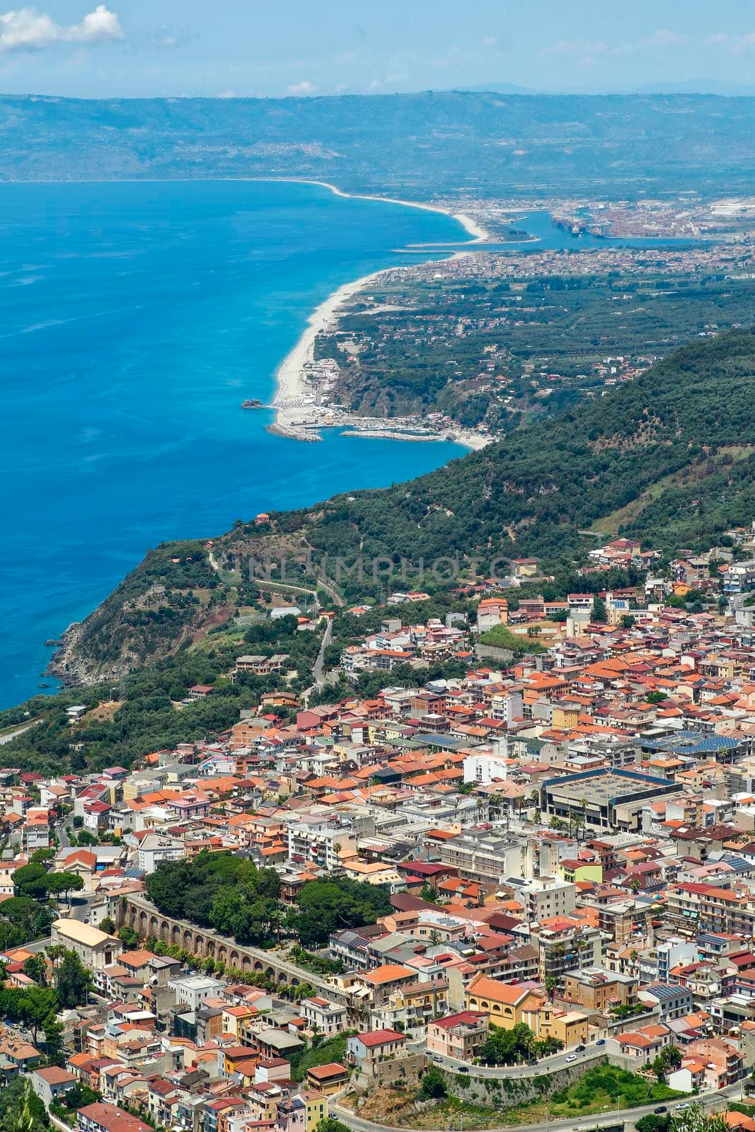 aerial view of the landscape of the Calabrian coast in Italy, you can see the port of Gioa Tauro and the neighboring countries, travel reportage