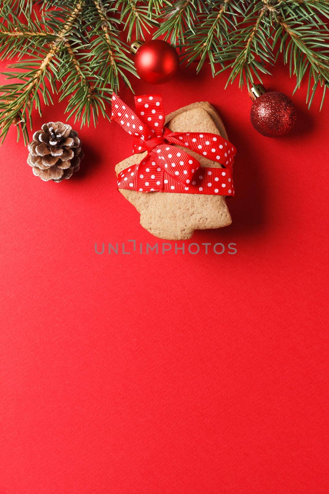 Delicious gingerbread and Christmas decor on a red background. copy space.