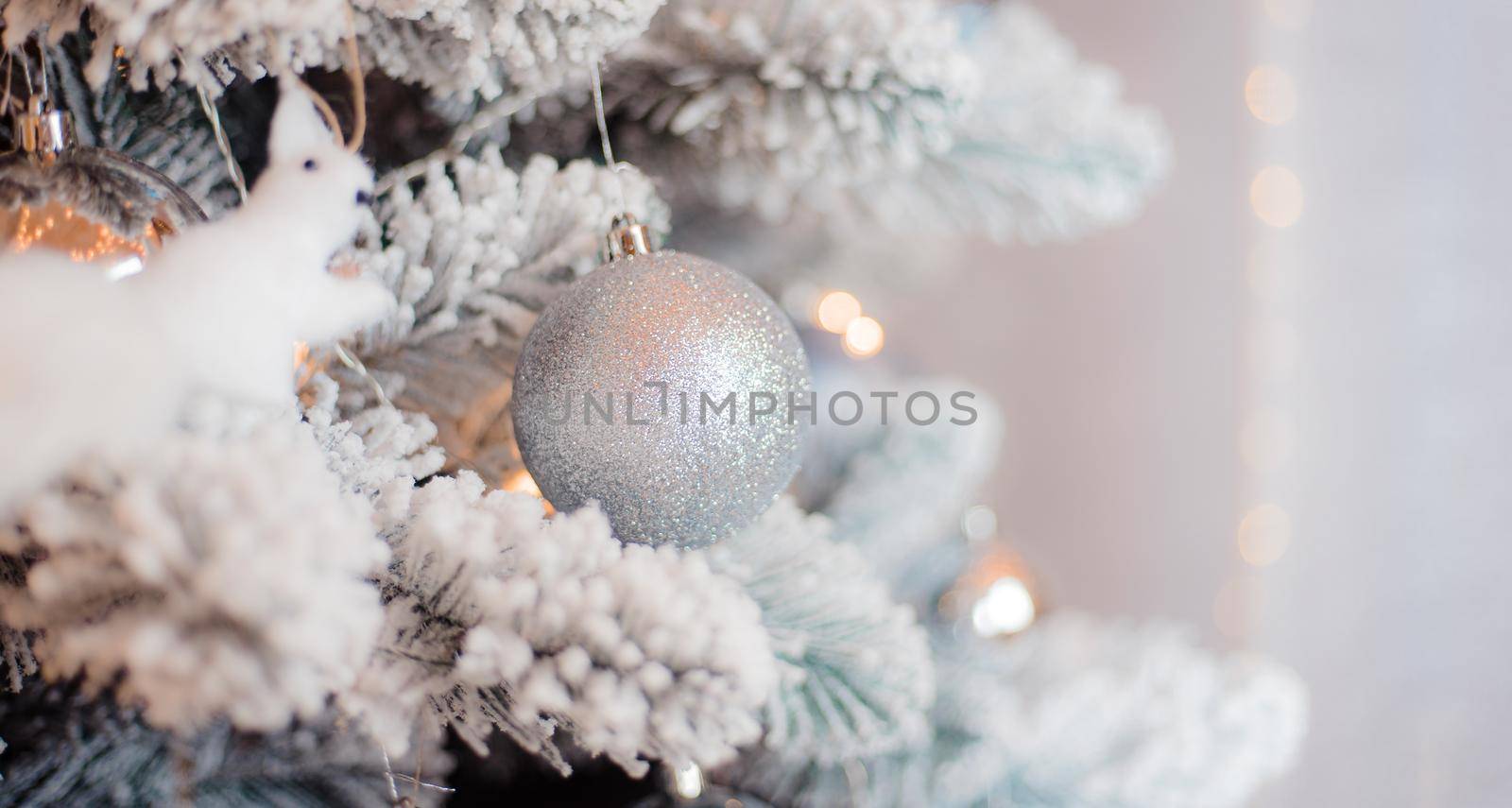 Balloons on the Christmas tree . New Year and Christmas. Festive decoration. Garland.