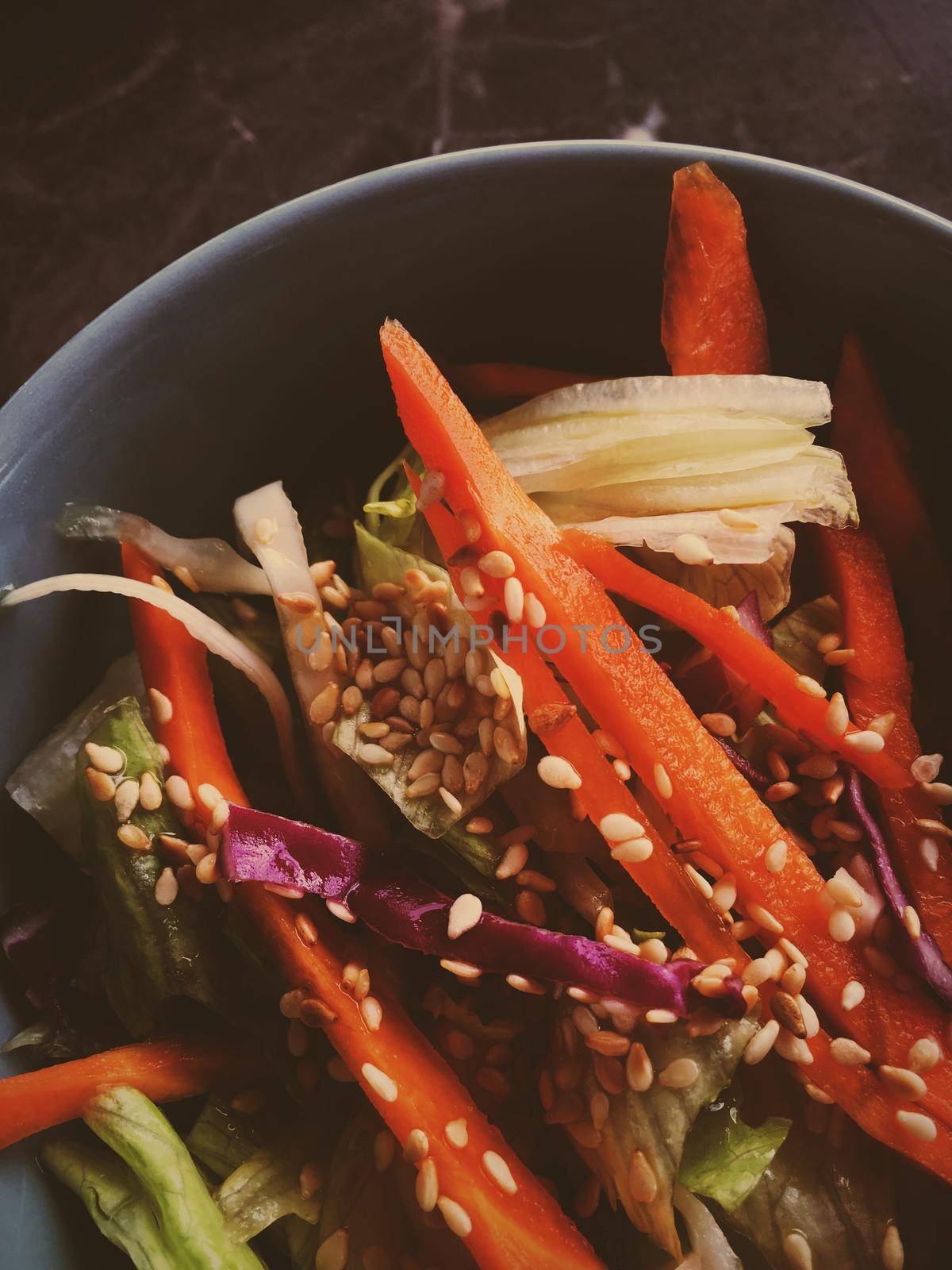 Vegan dieting, eating out and oriental cuisine concept - Vegetarian asian vegetable salad served in a bowl in japanese restaurant, healthy diet food