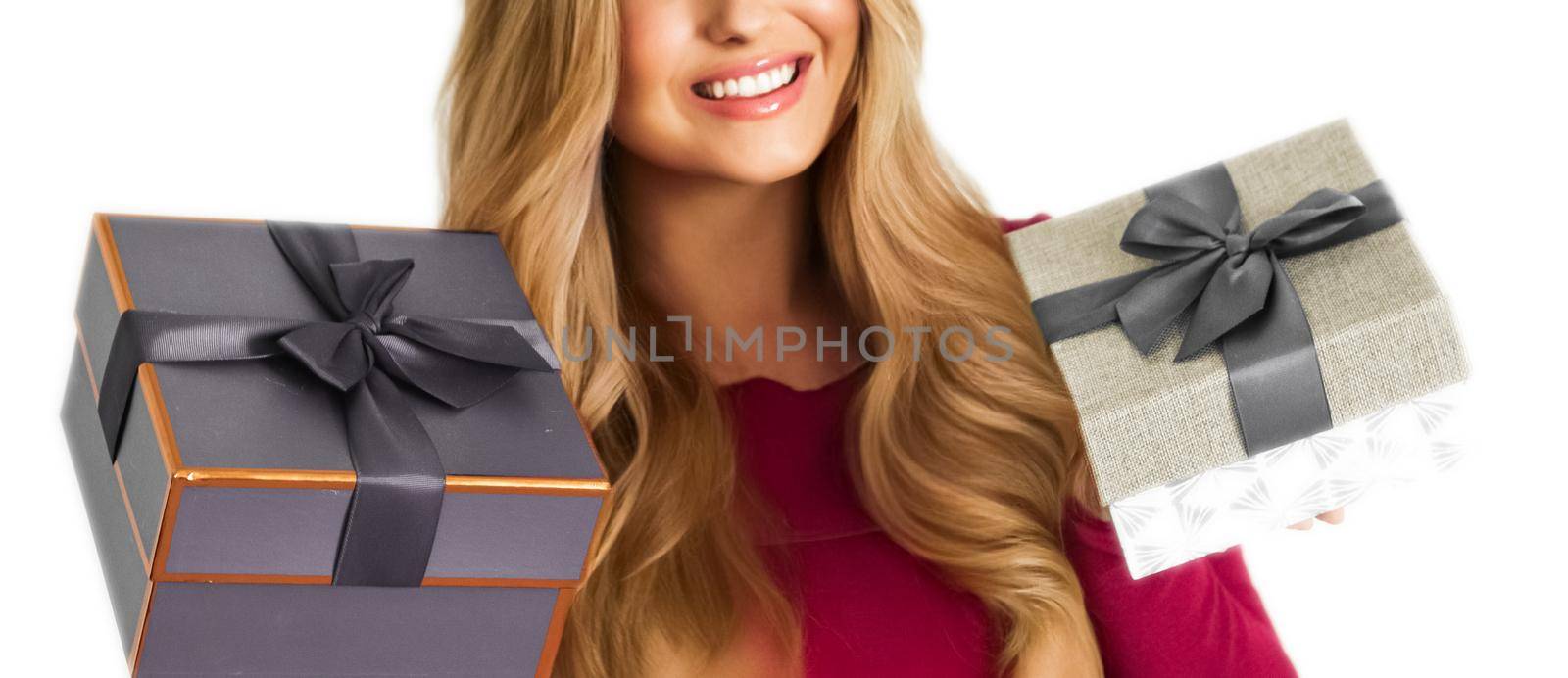 Birthday, Christmas gifts or holiday present, happy woman holding gift boxes isolated on white background, portrait