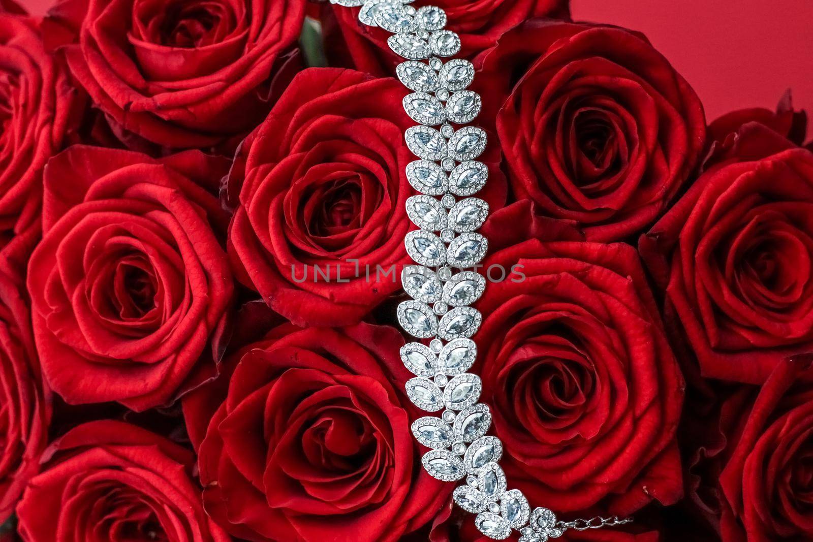 Gemstone jewellery, wedding fashion and luxe shopping concept - Luxury diamond bracelet and bouquet of red roses, jewelry love gift on Valentines Day and romantic holidays present