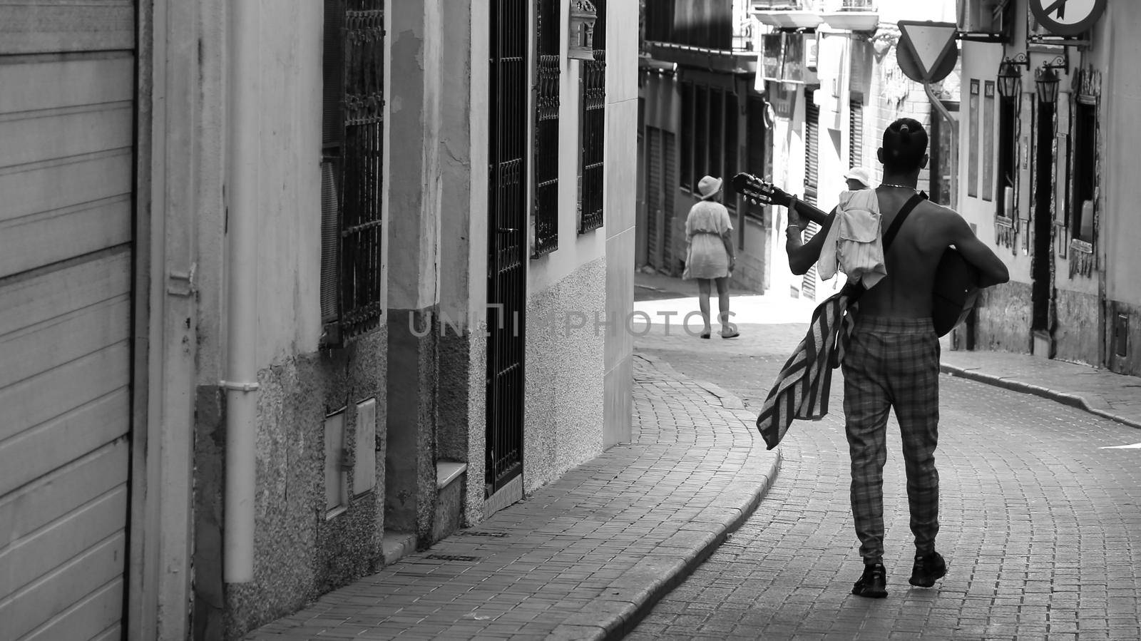 Benidorm, Alicante, Spain-September 11, 2022: Musician playing flamenco music with Spanish Guitar on the street in Benidorm