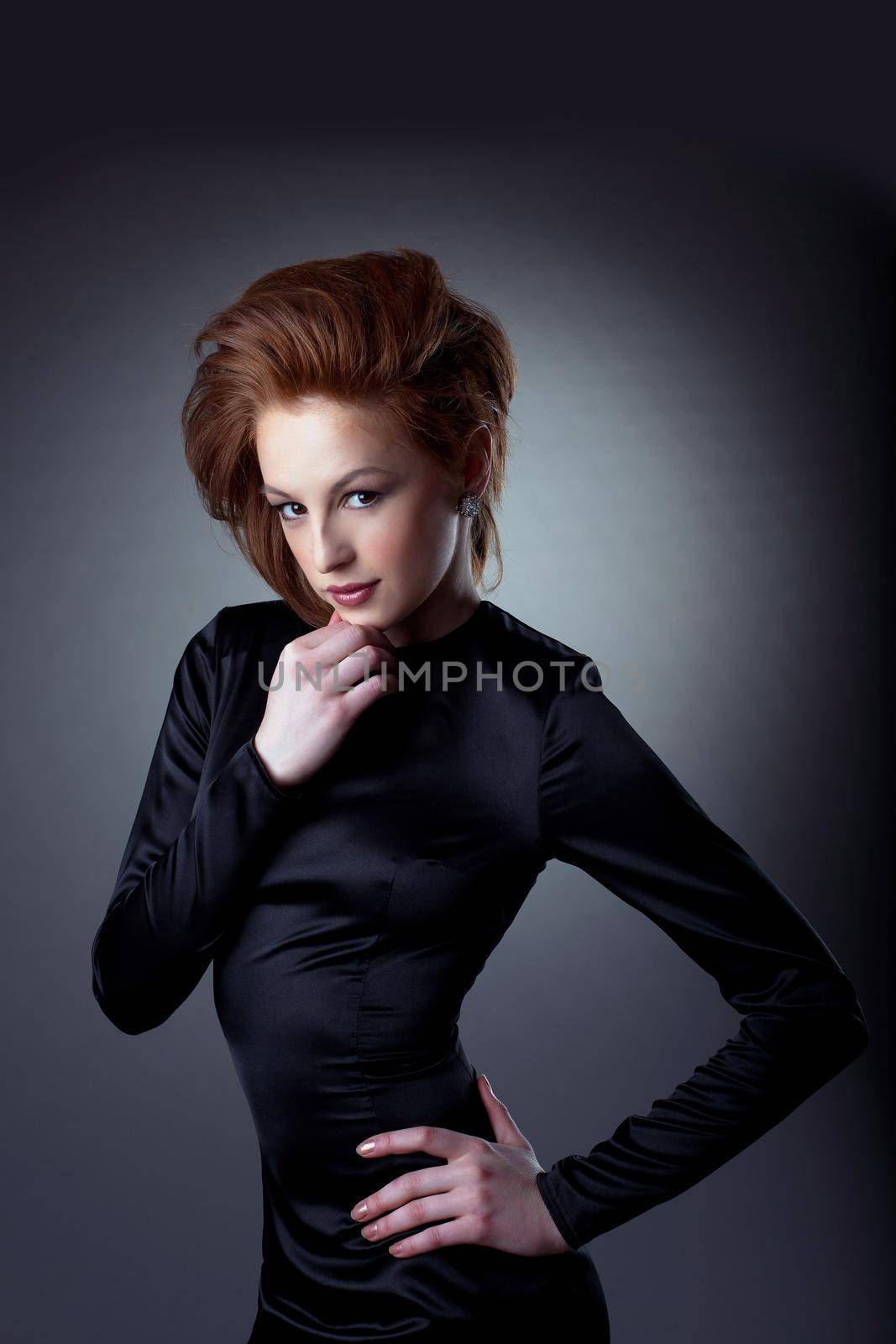 Young woman sexy fashion portrait posing on dark