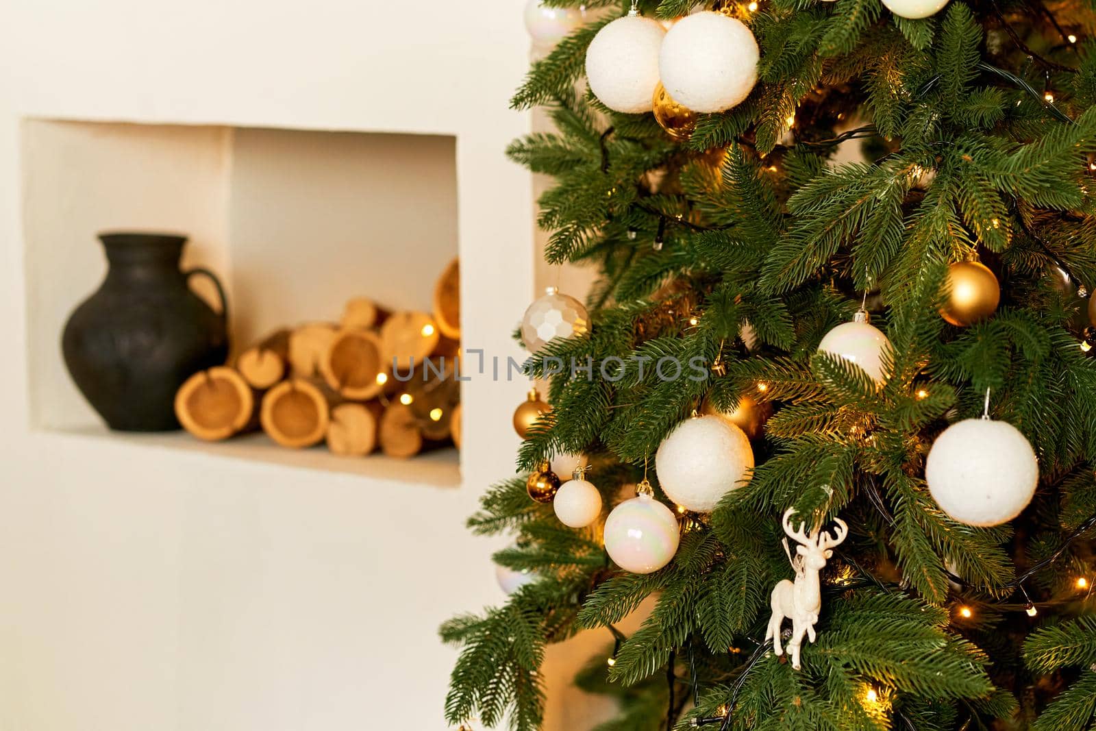 Cozy festive interior with a Christmas tree. Holidays at home with your family.