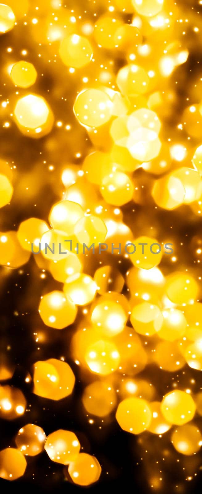 Golden Christmas lights, New Years Eve fireworks and abstract texture concept - Glamorous gold shiny glow and glitter, luxury holiday background