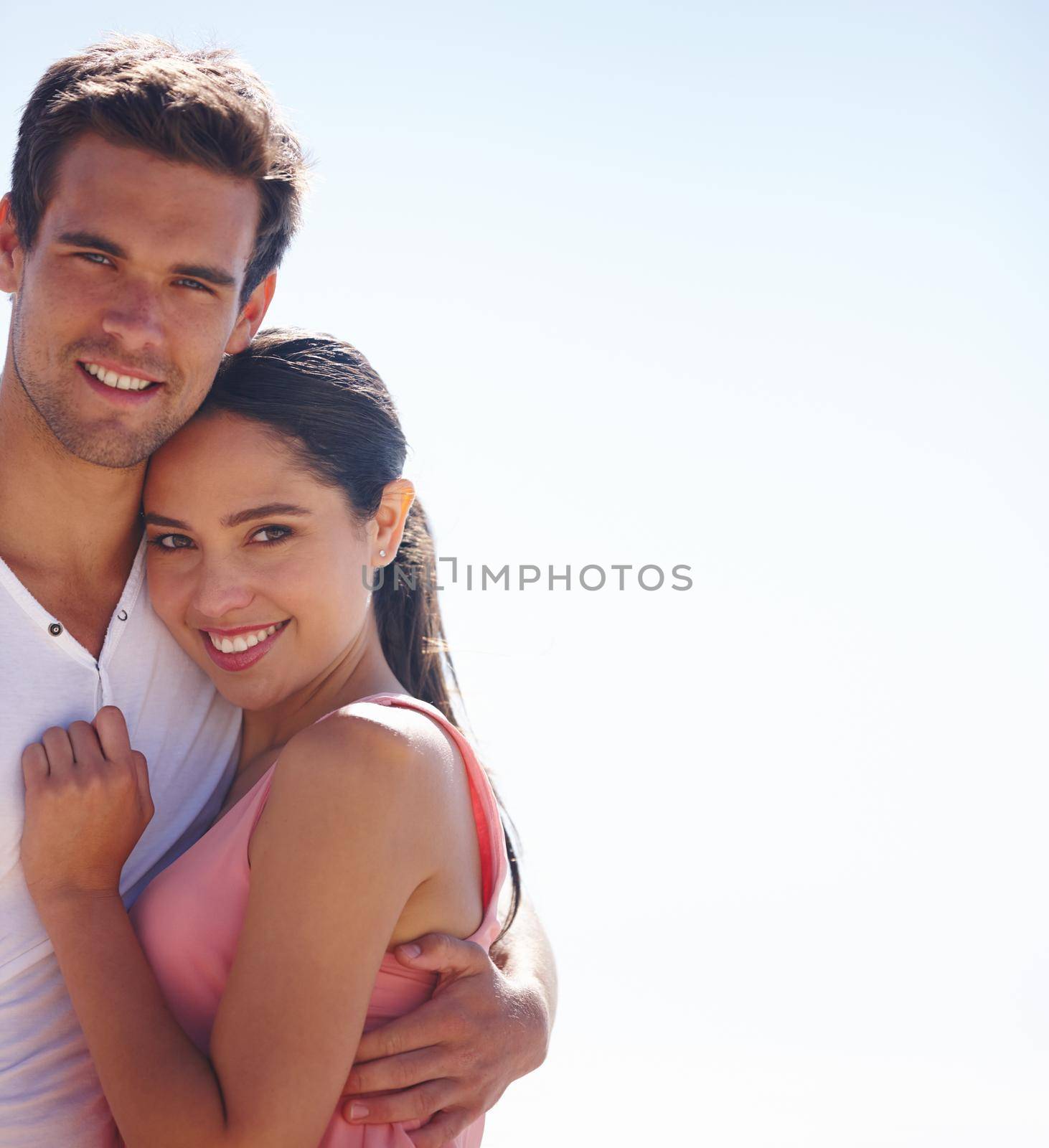 Shes happiest when in his arms. a young couple outdoors