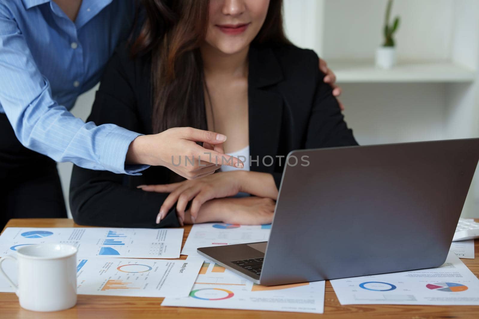 Business People Meeting to discuss and brainstorming the financial report paperwork in home office. Financial advisor teamwork and accounting concept.