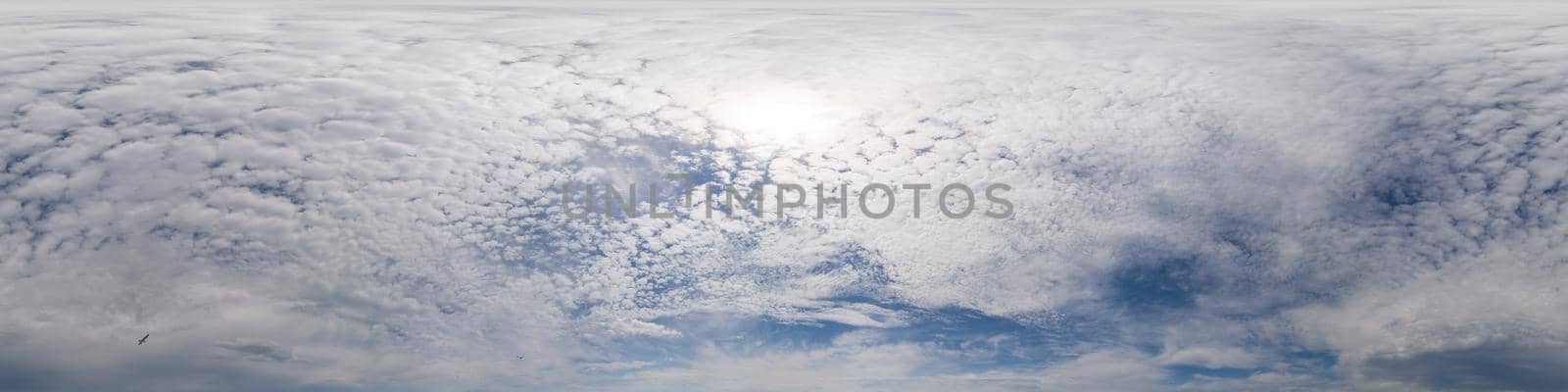 Blue sky with Cumulus clouds Seamless panorama in spherical equirectangular format. Complete zenith for use in 3D graphics, game and for composites in aerial drone 360 degree panoramas as a sky dome.