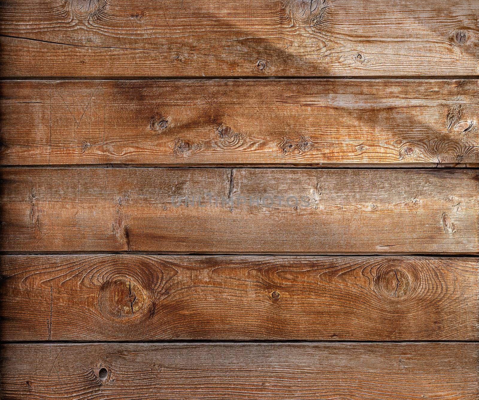 wooden background, copy space. Vintage boards with wood pattern and sunbeams by Ramanouskaya