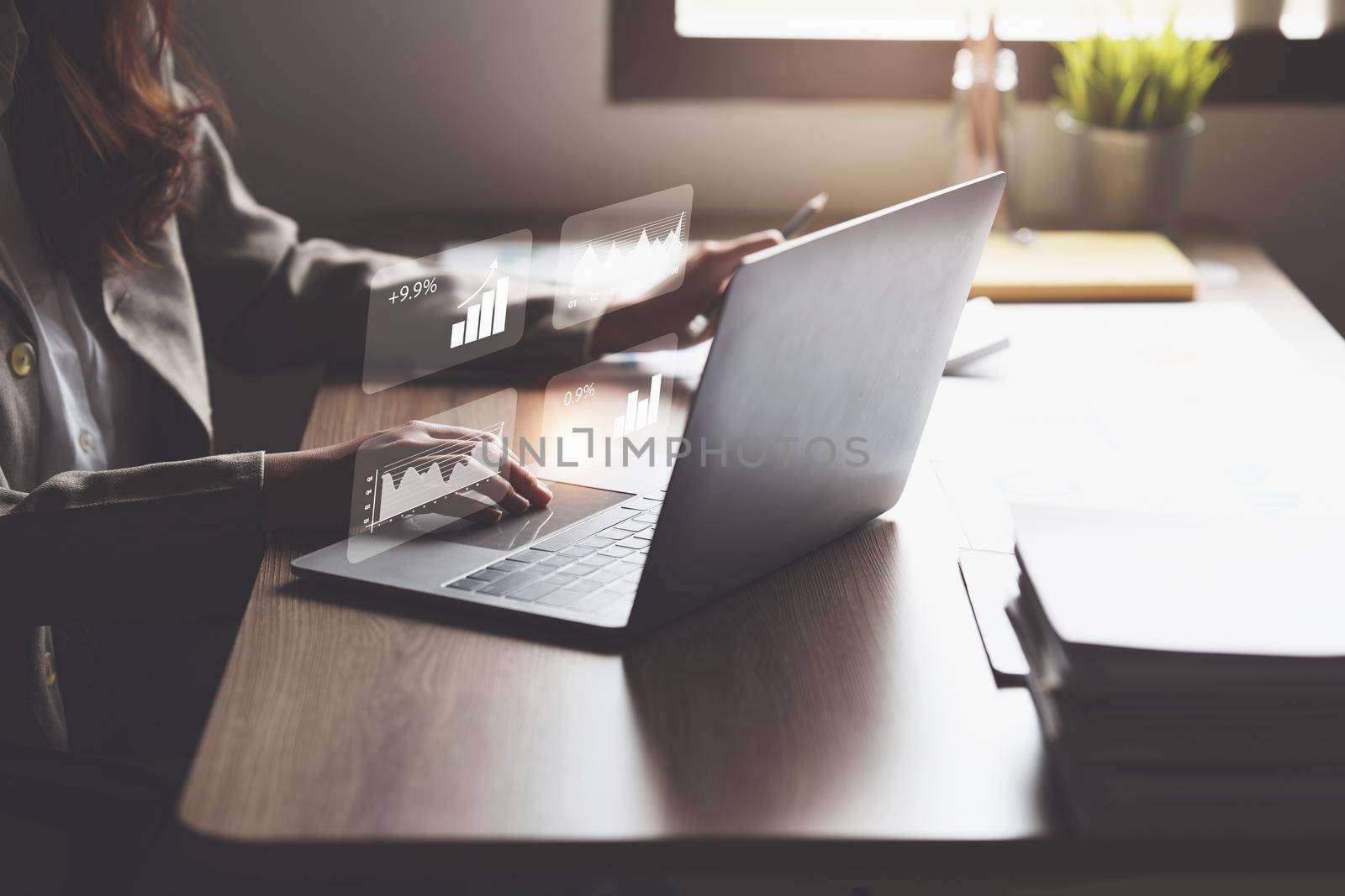 Business woman hand holding pen and pointing at financial paperwork with social network diagram