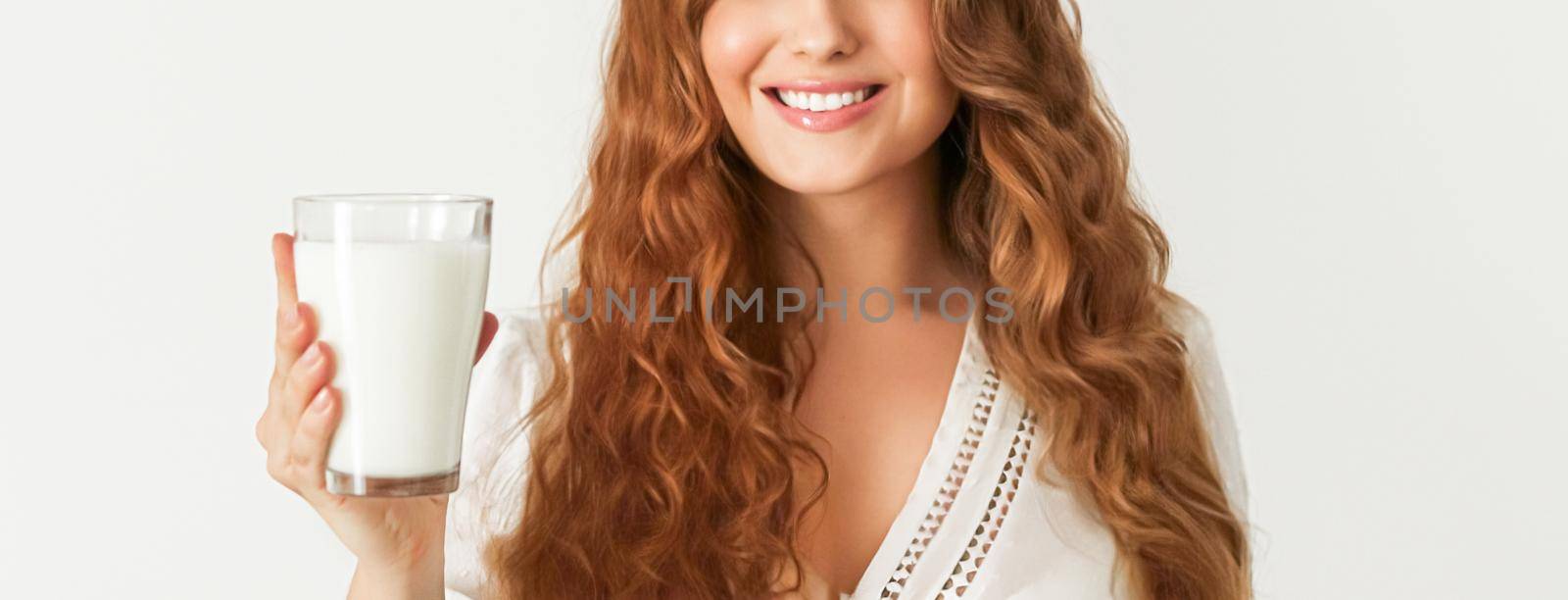 Diet, health and wellness concept, woman holding glass of milk or protein shake cocktail