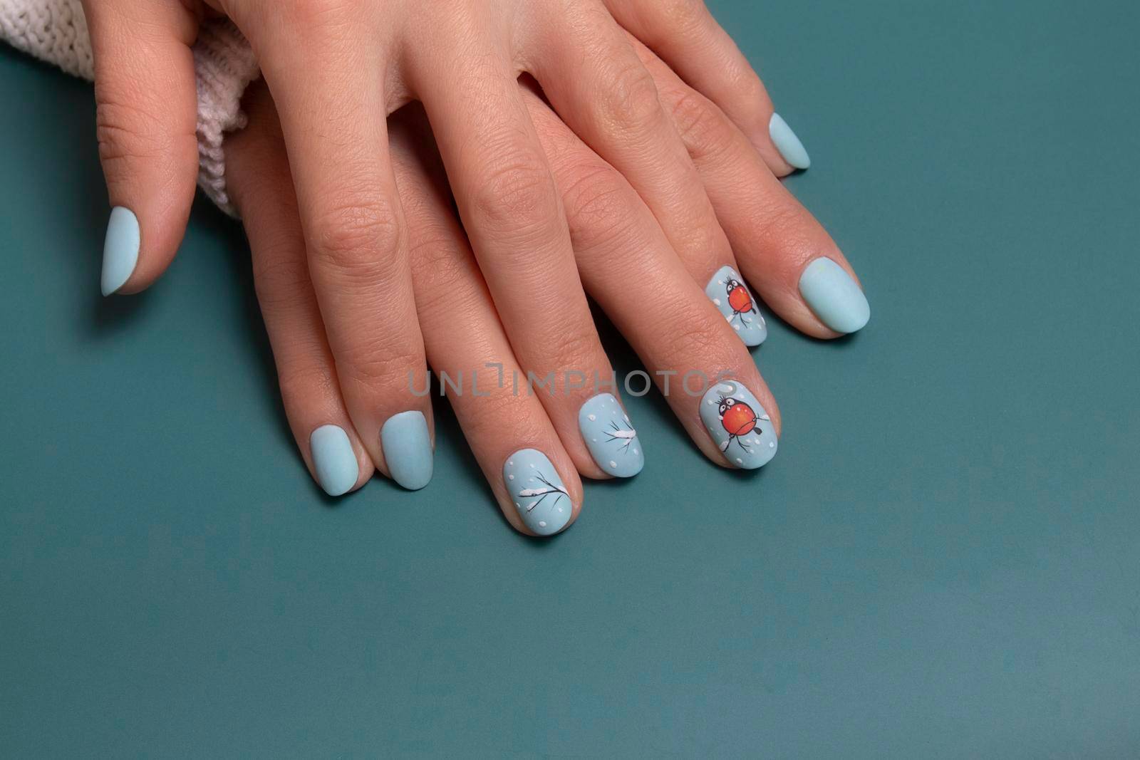 Female hands with winter snow manicure with stickers under a matte top by ssvimaliss