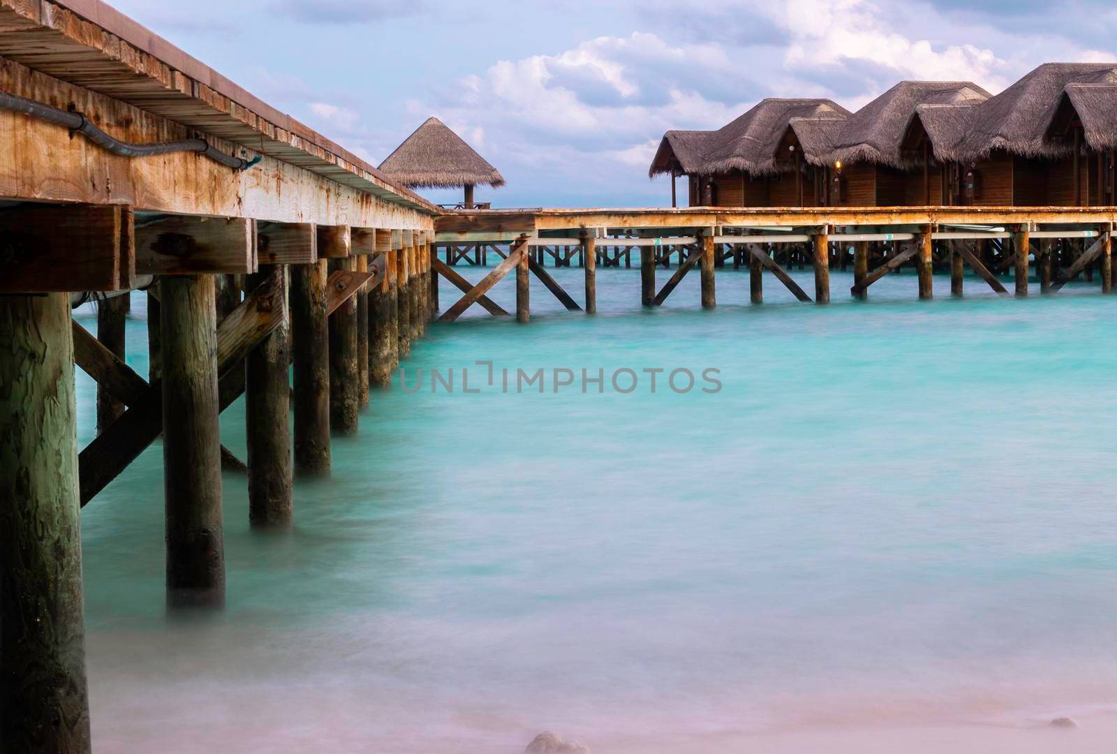 Shot of a over water bungalows on tropical island