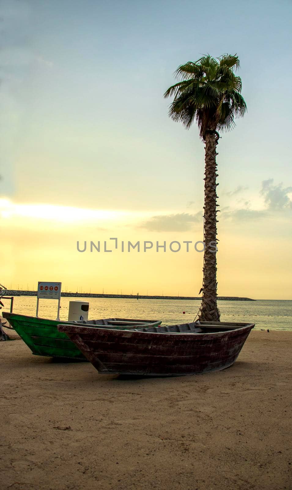 Boats on the La Mer beach in Jumeirah area, Dubai, UAE. by pazemin