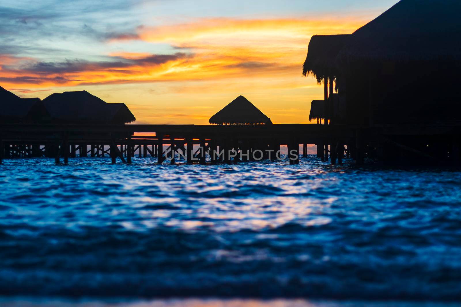 Shot of a over water bungalows on tropical island