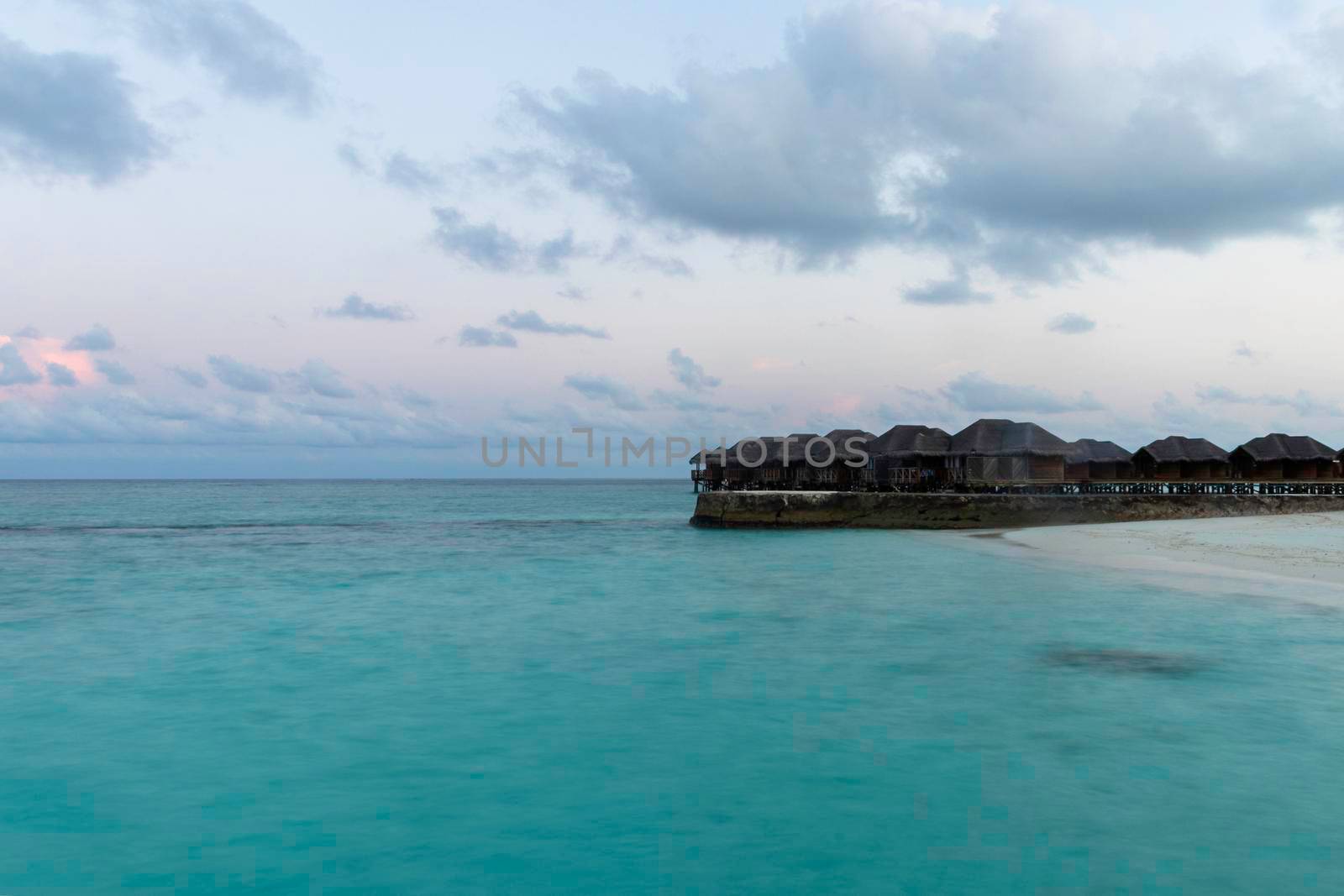 Shot of a over water bungalows on tropical island. Holiday by pazemin