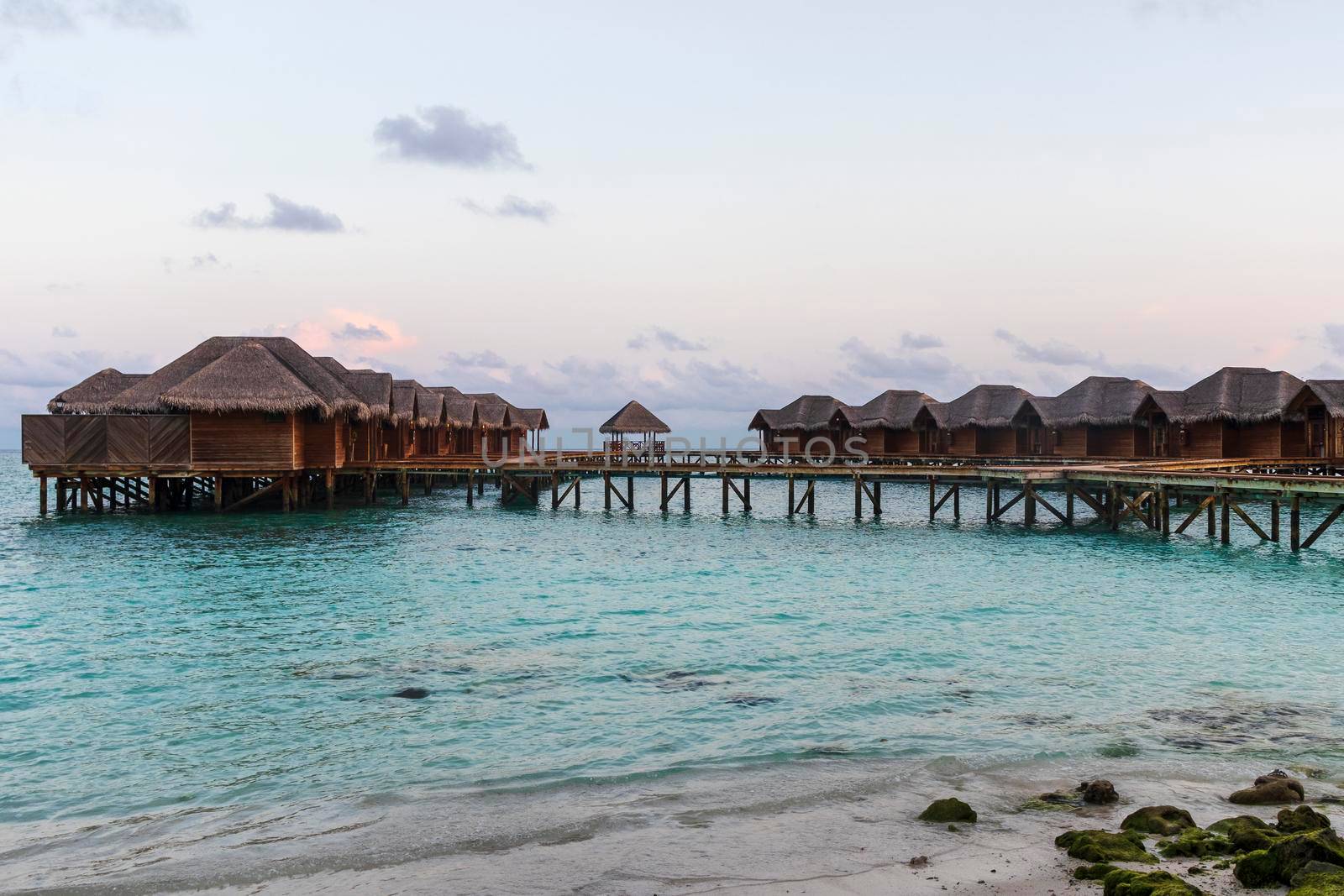 Shot of a over water bungalows on tropical island. Holiday by pazemin