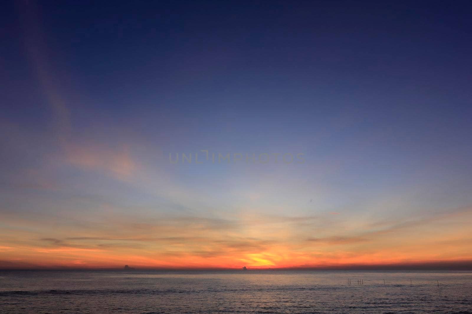photograph of the sunrise from the sea and the beautiful sky and morning clouds