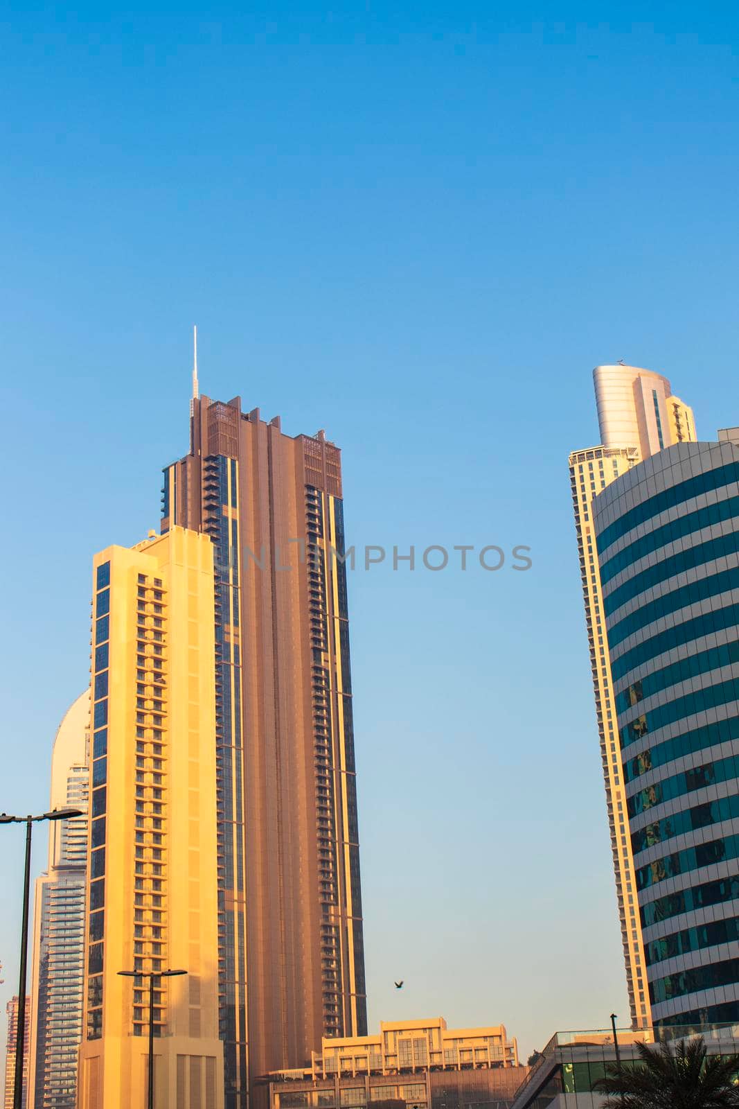 Dubai, UAE - 01.15.2021 Morning hour in Business bay district , Marasi drive. Burj Khalifa, tallest building in the world can be seen in the scene