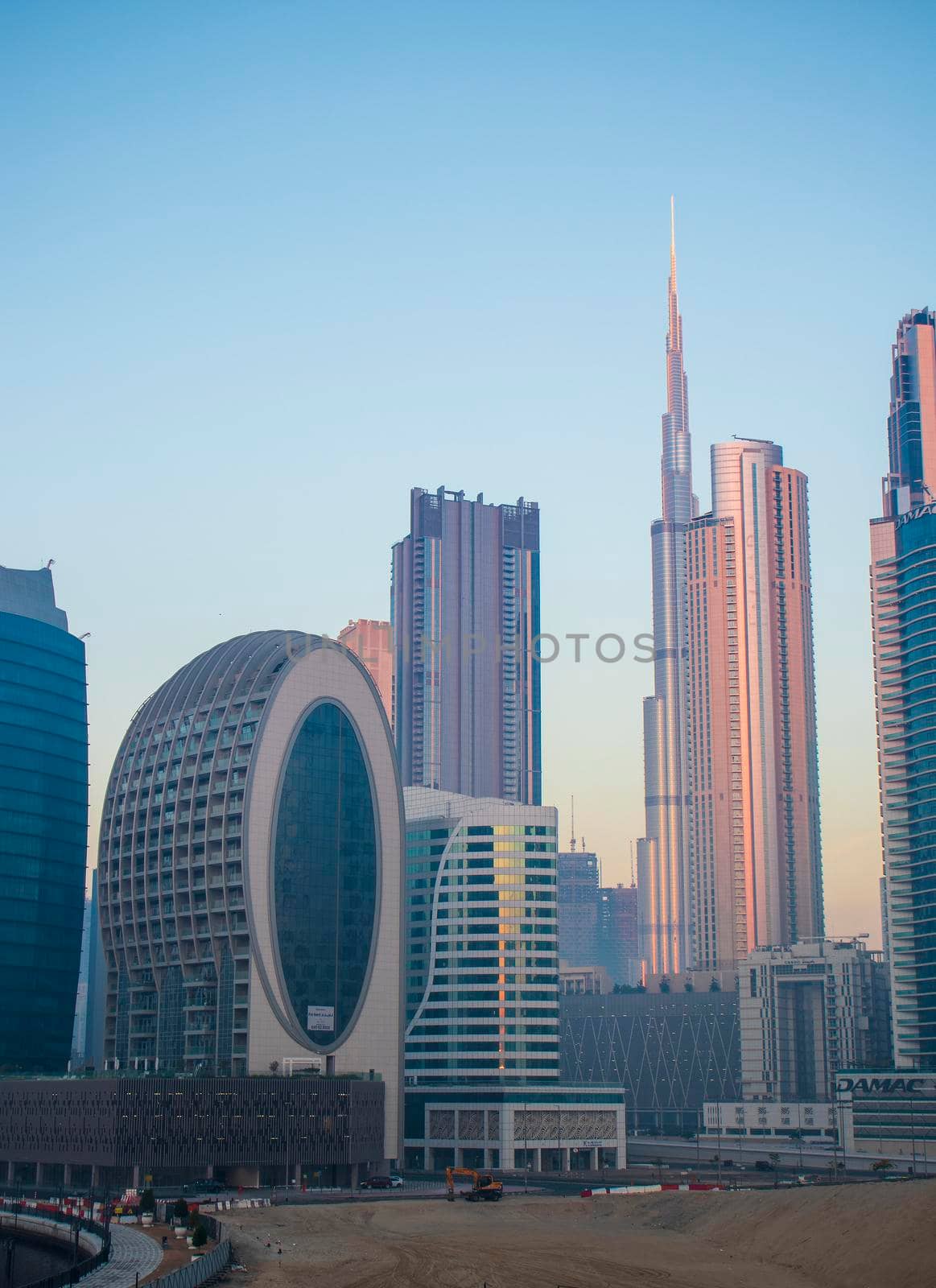 Dubai, UAE - 01.15.2021 Morning hour in Business bay district , Marasi drive. Burj Khalifa, tallest building in the world can be seen in the scene. Outdoors by pazemin