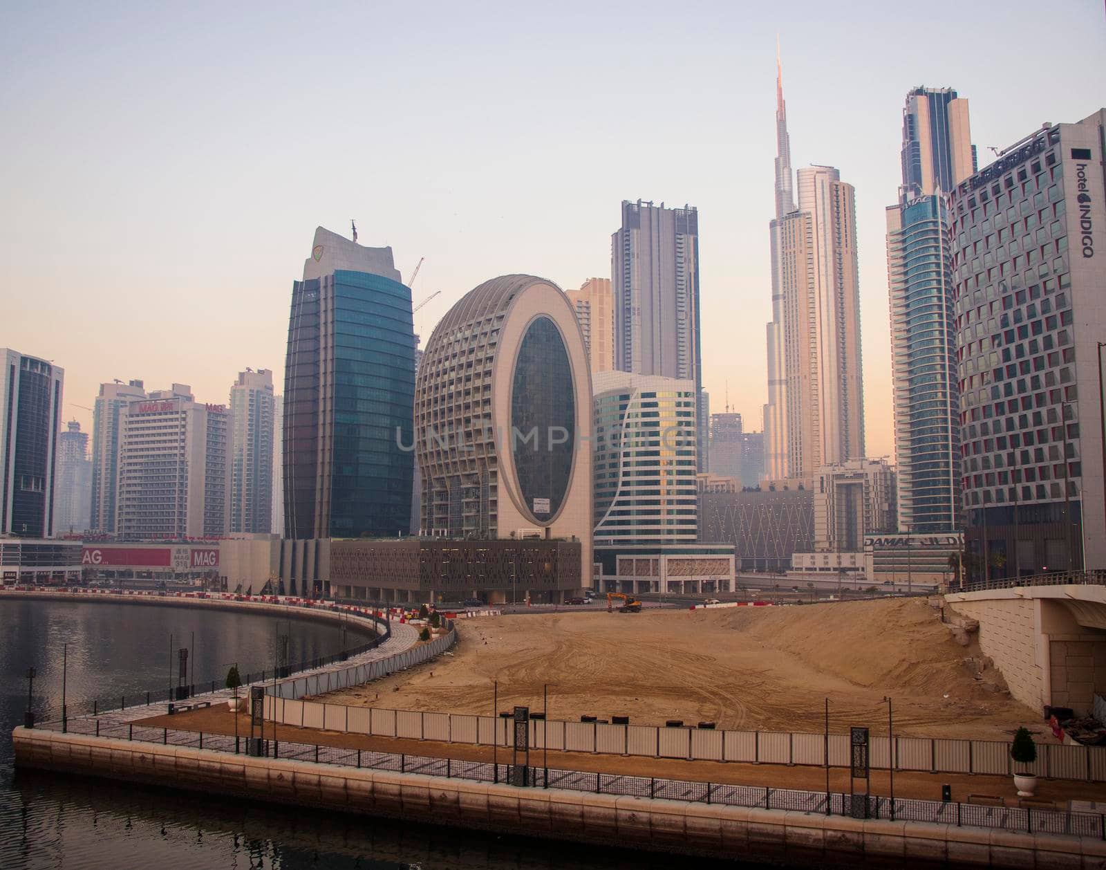 Dubai, UAE - 01.15.2021 Morning hour in Business bay district , Marasi drive. Burj Khalifa, tallest building in the world can be seen in the scene. Outdoors by pazemin