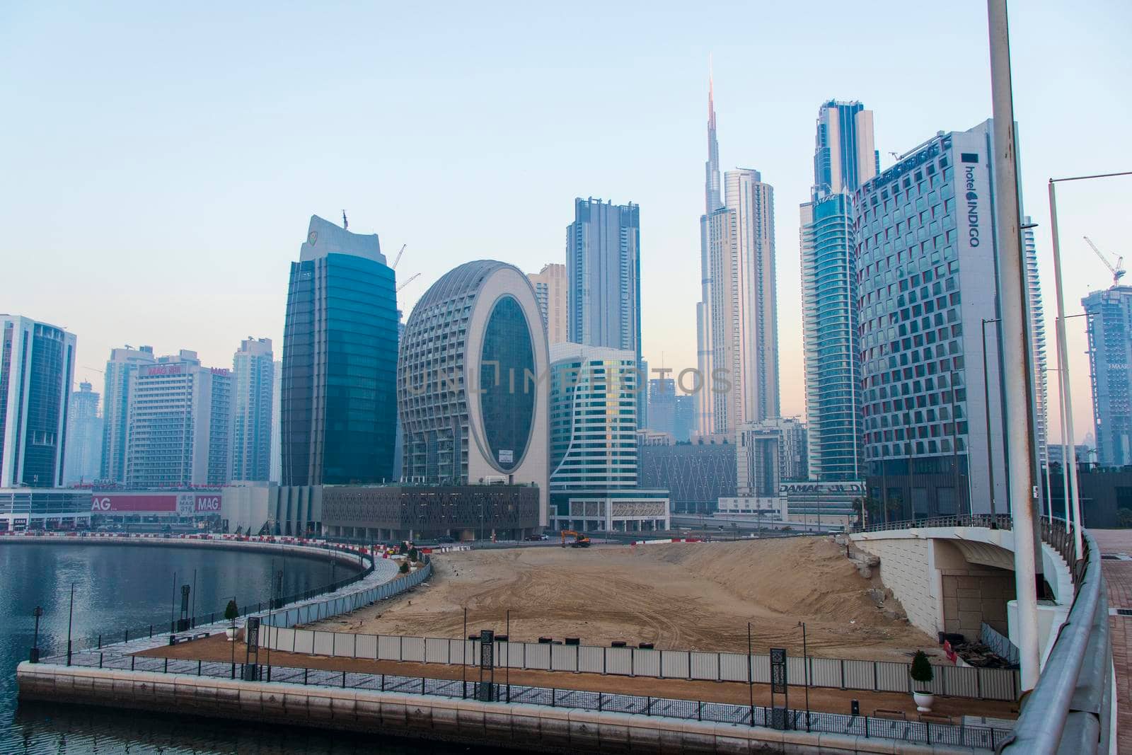 Dubai, UAE - 01.15.2021 Morning hour in Business bay district , Marasi drive. Burj Khalifa, tallest building in the world can be seen in the scene. Outdoors by pazemin