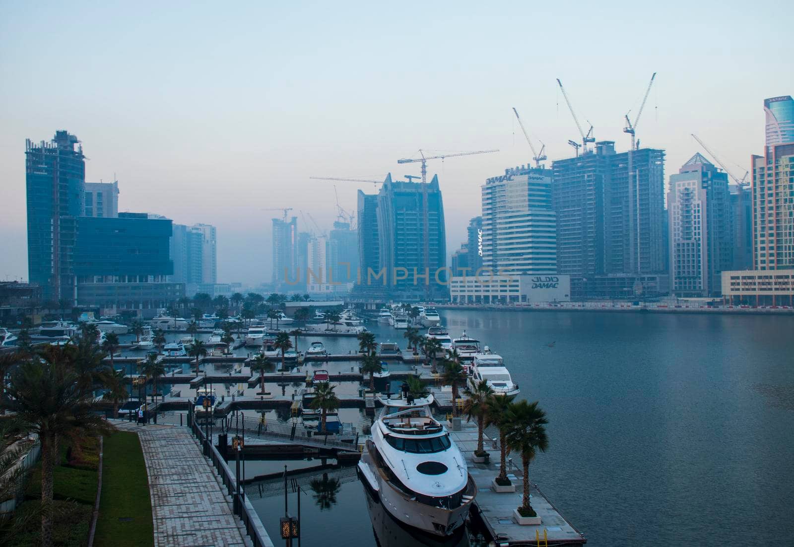 Dubai, UAE - 01.15.2021 Sunrise over a Dubai water canal. Outdoors by pazemin