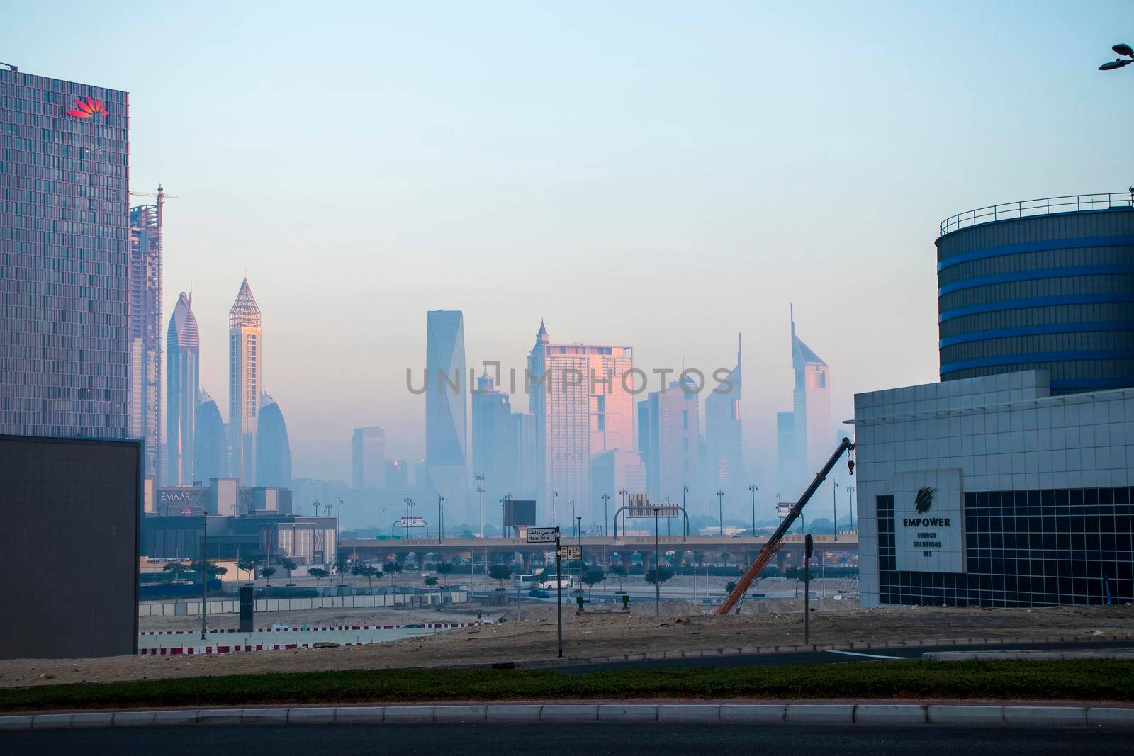 Dubai, UAE - 01.15.2021 Cityscape rising from the fog. Outdoors by pazemin