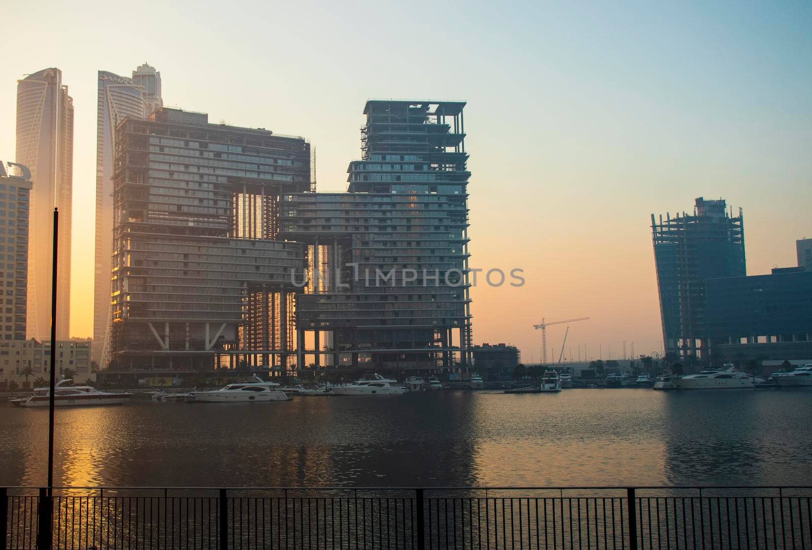 Dubai, UAE - 01.15.2021 Sunrise over a Dubai water canal. Outdoors by pazemin