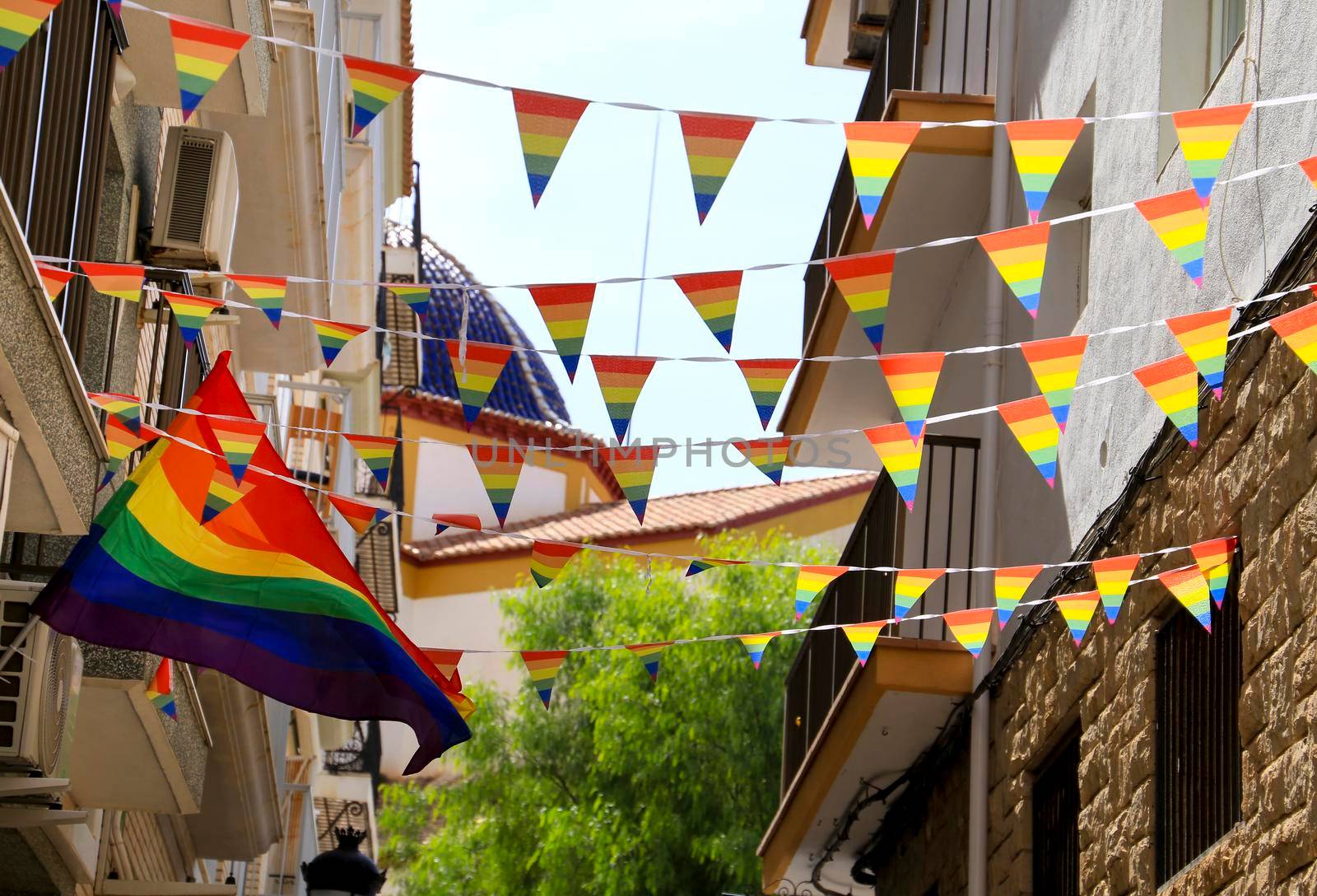 Streets and facades adorned with rainbow flags in Benidorm by soniabonet