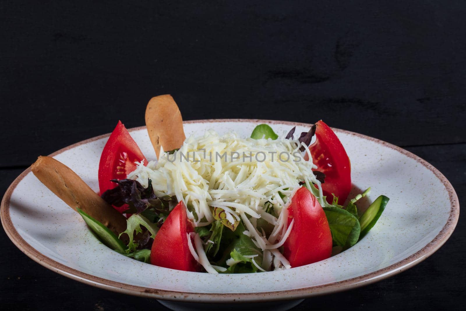 healthy eating, dieting, vegetarian kitchen and cooking concept - close up of vegetable salad bowl at home. High quality photo