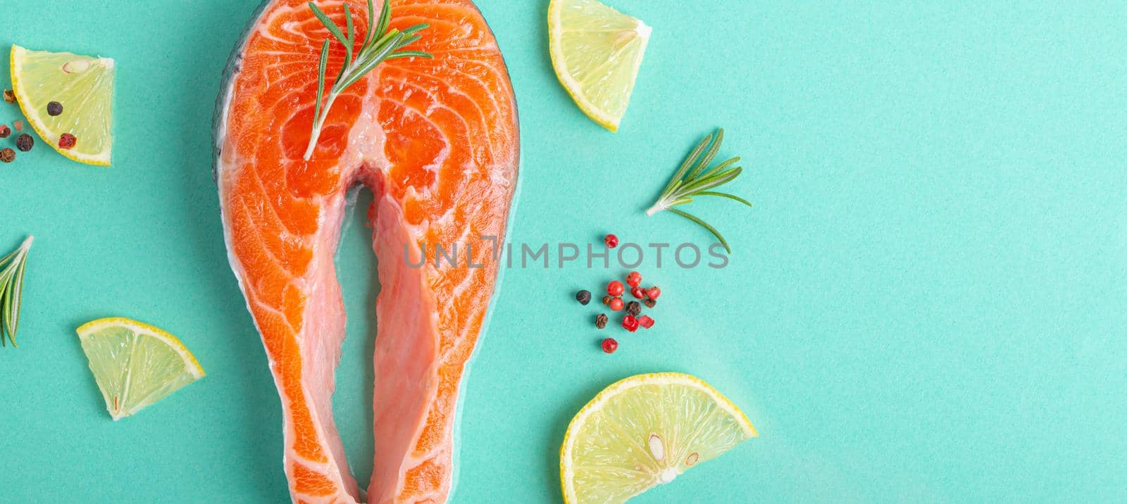 Raw fresh fish salmon steak top view on blue clean background from above by its_al_dente