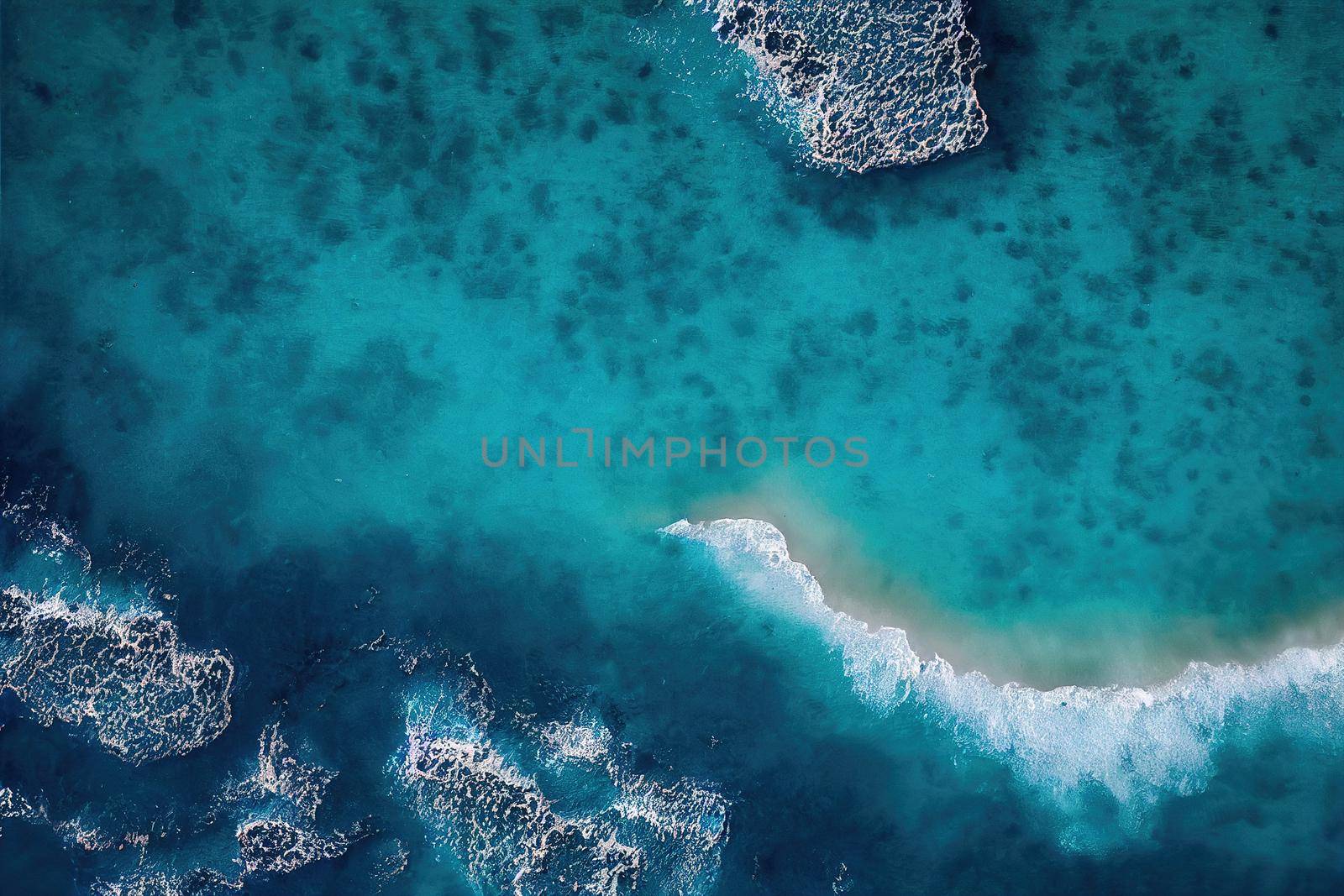 Beach and waves from above. ater background from the top. Summer attacks from the air. Aerial view of a blue ocean