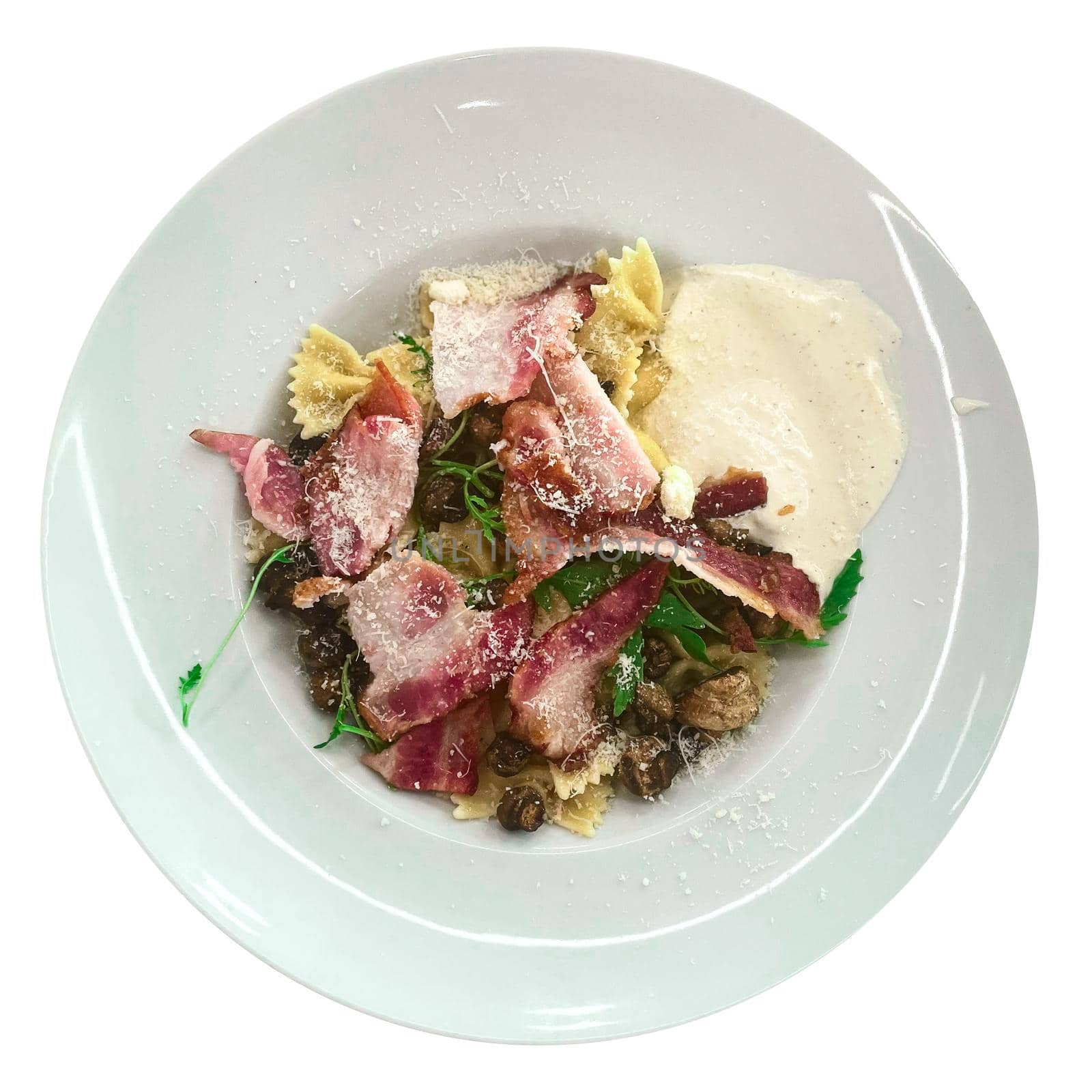Pasta carbonara in a white plate isolated by yganko