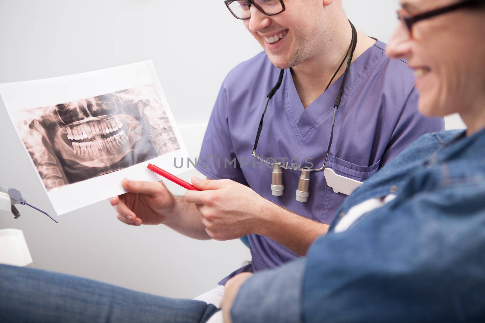 Cropped shot of a dentist and mature woman patient discussing her dental x-ray scan