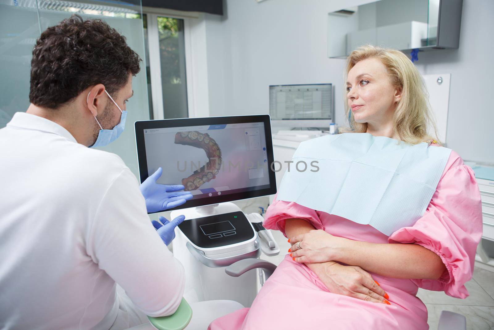 Mature woman at dental clinic by MAD_Production